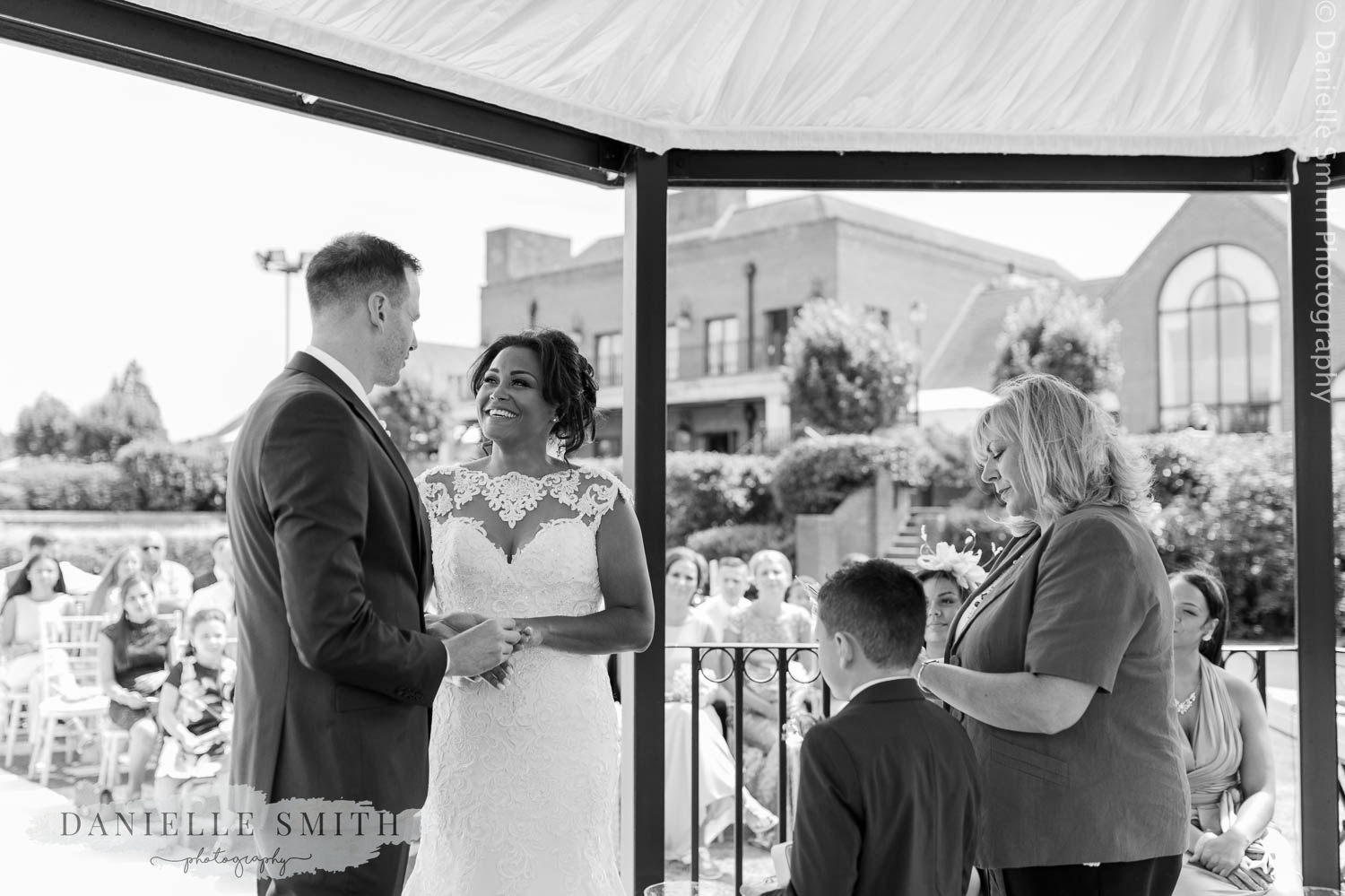 bride and groom laughing during ceremony