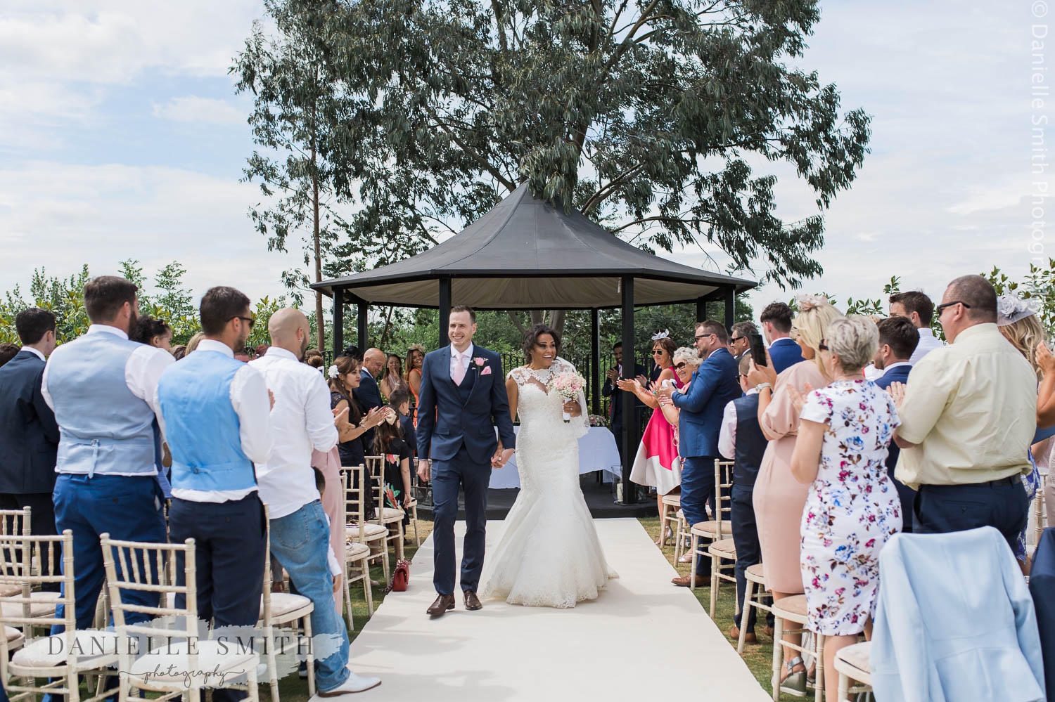 bride and groom walking down aisle