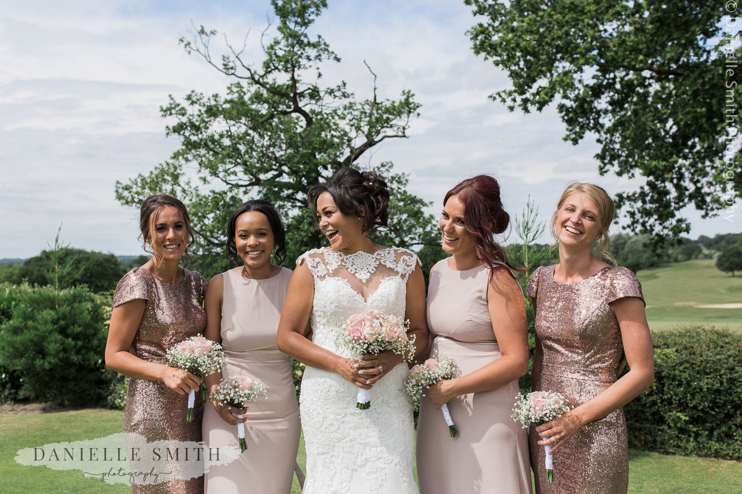 bride and bridesmaids in blush pink and sequin dresses