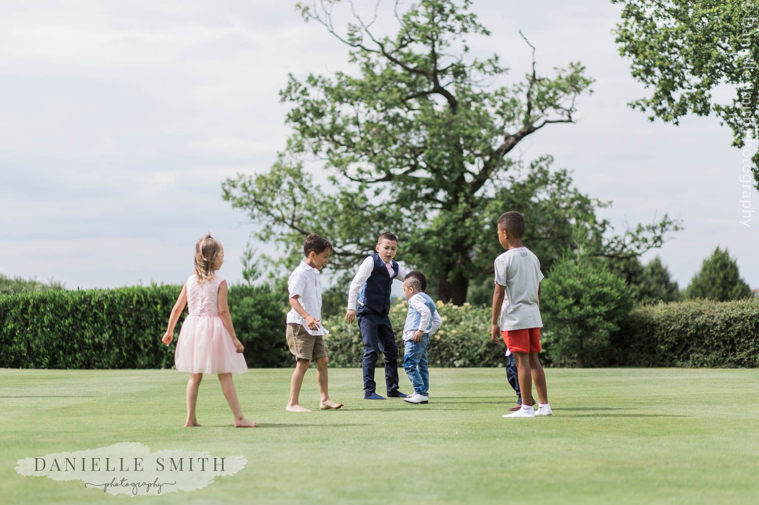wedding guests playing in garden at stock brook manor