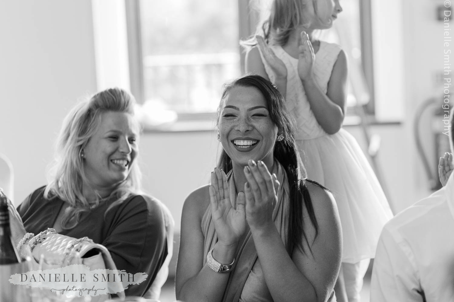 wedding guest clapping at speech