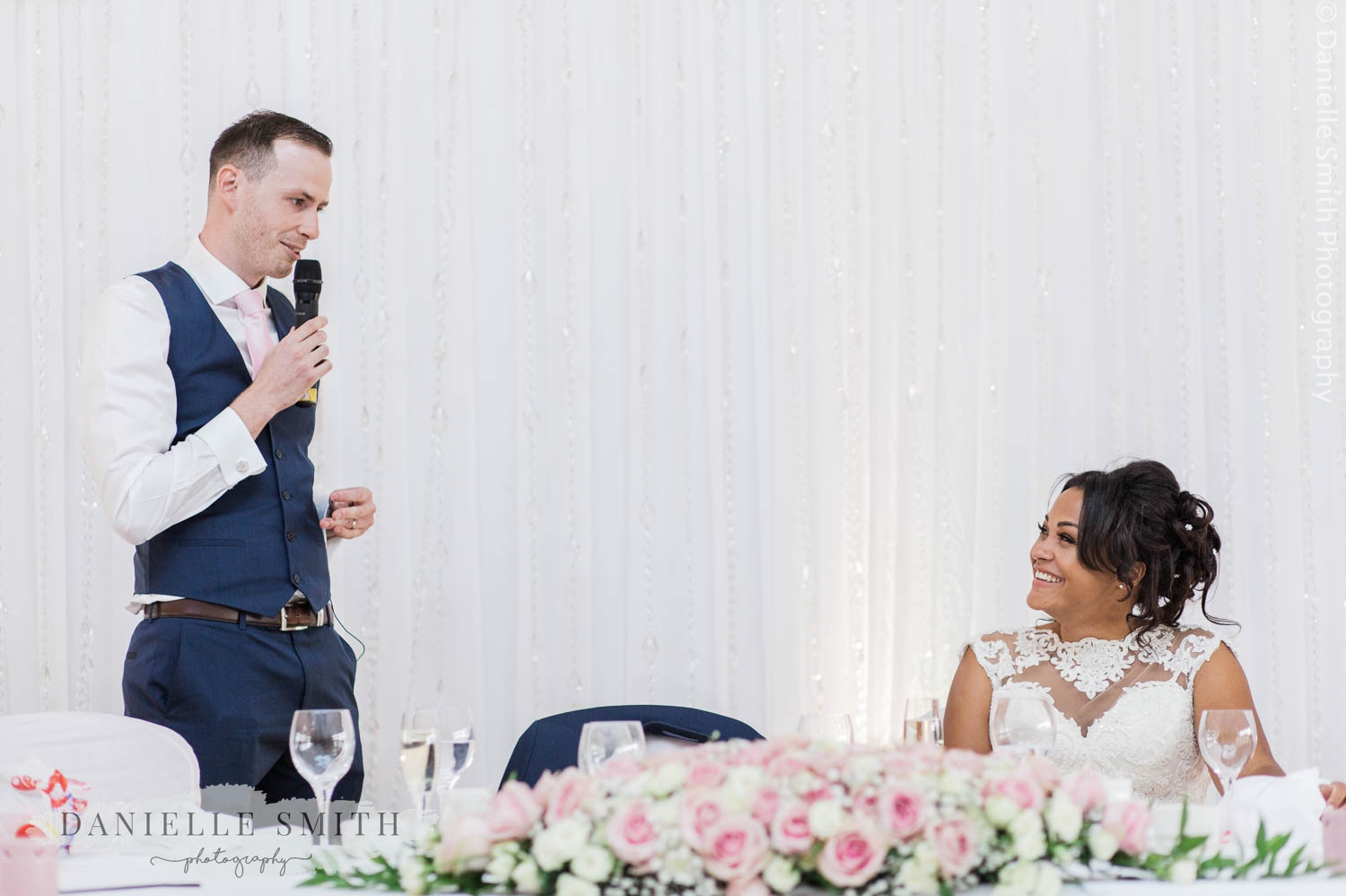 groom giving speech to his wife