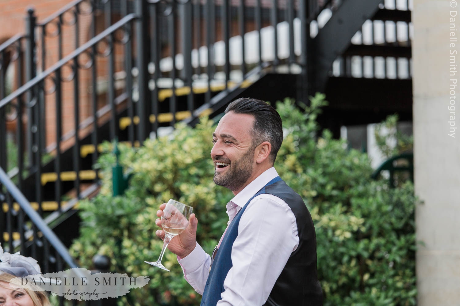 wedding guest laughing