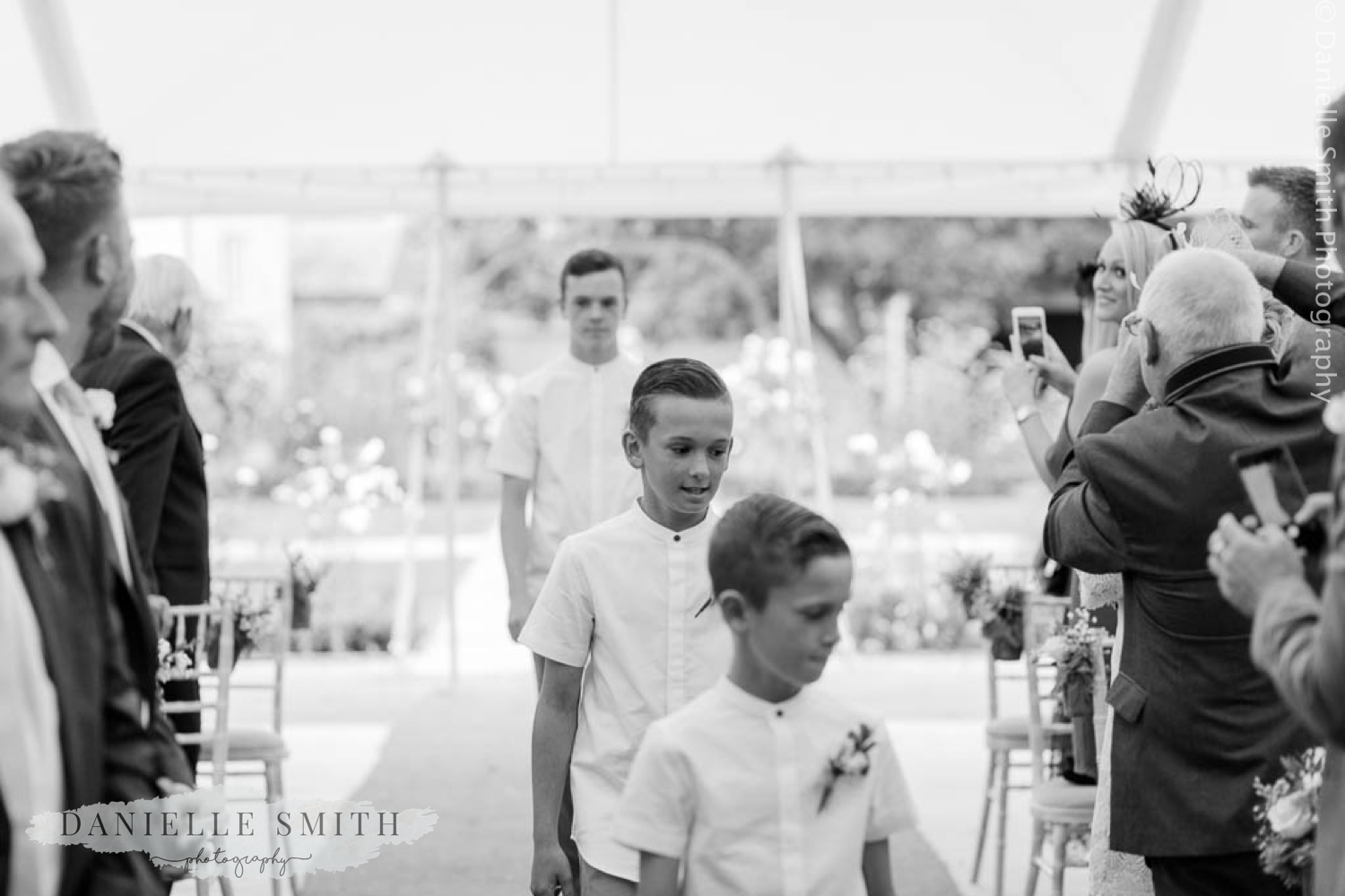 page boys walking down aisle
