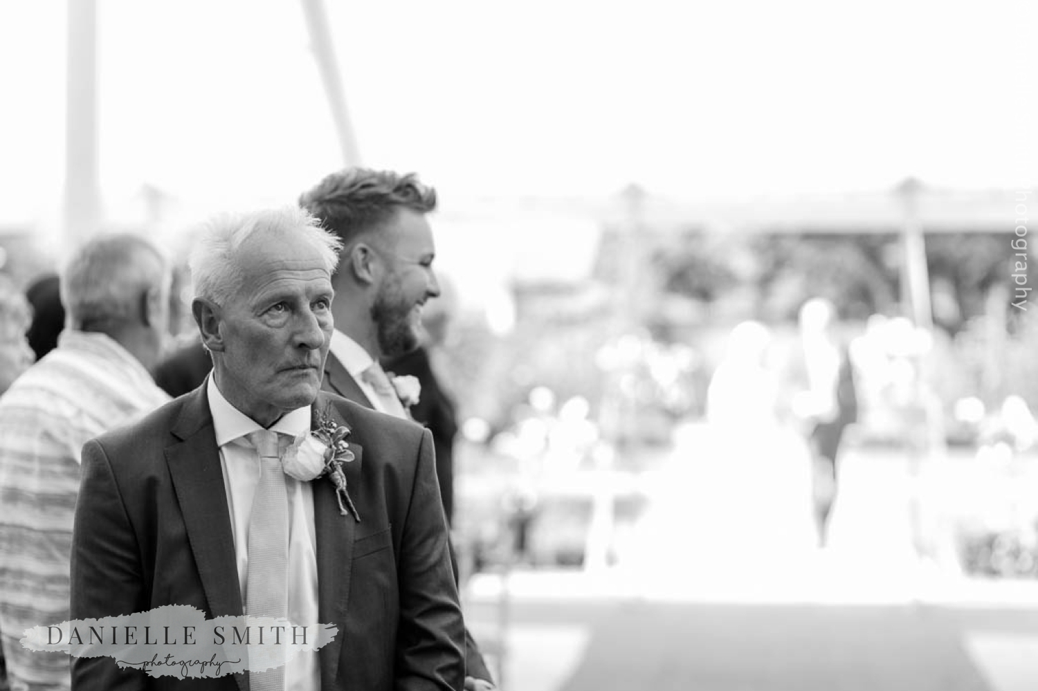 groom looking worried as waits for bride