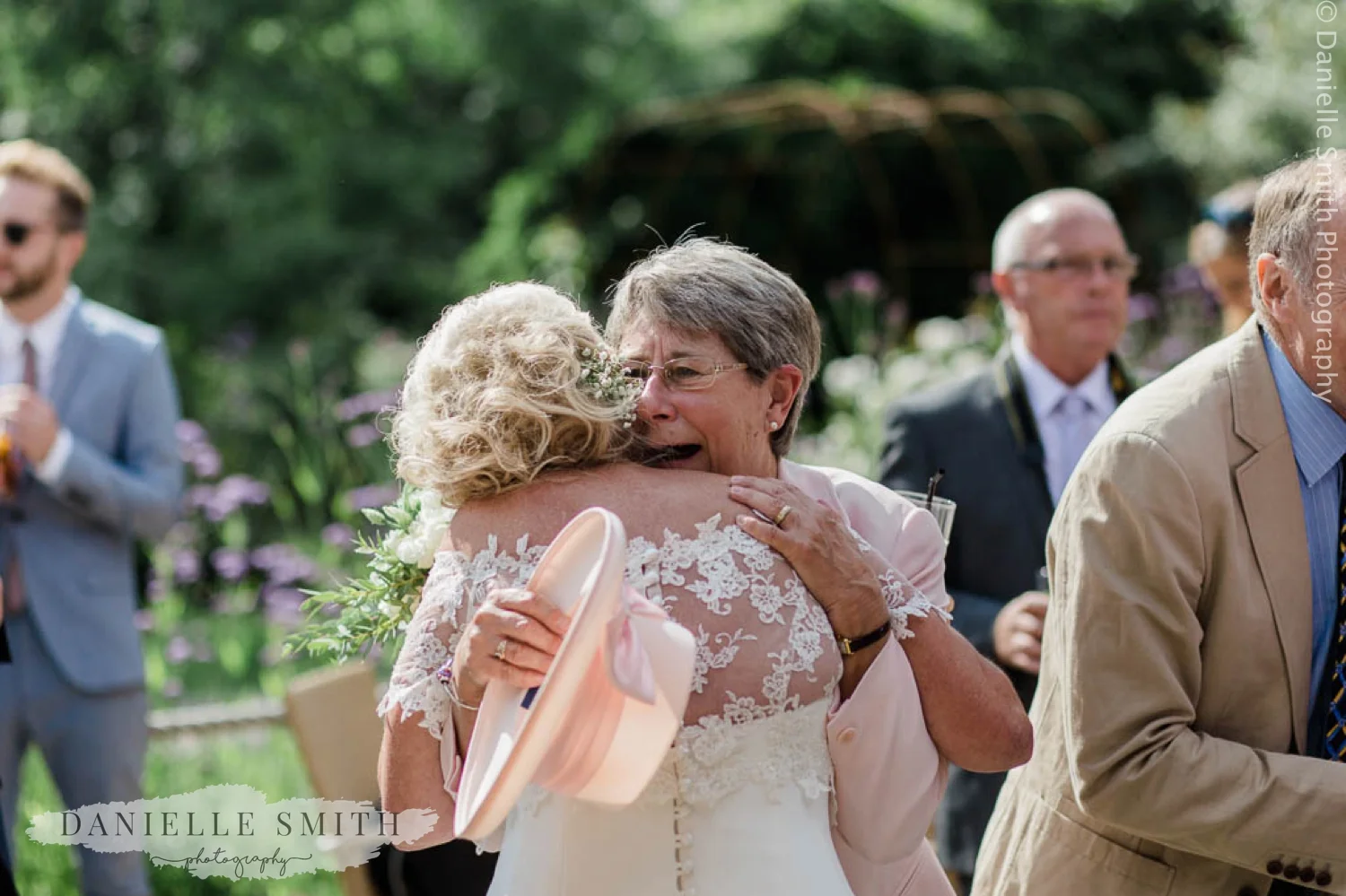new sister in law hugging bride