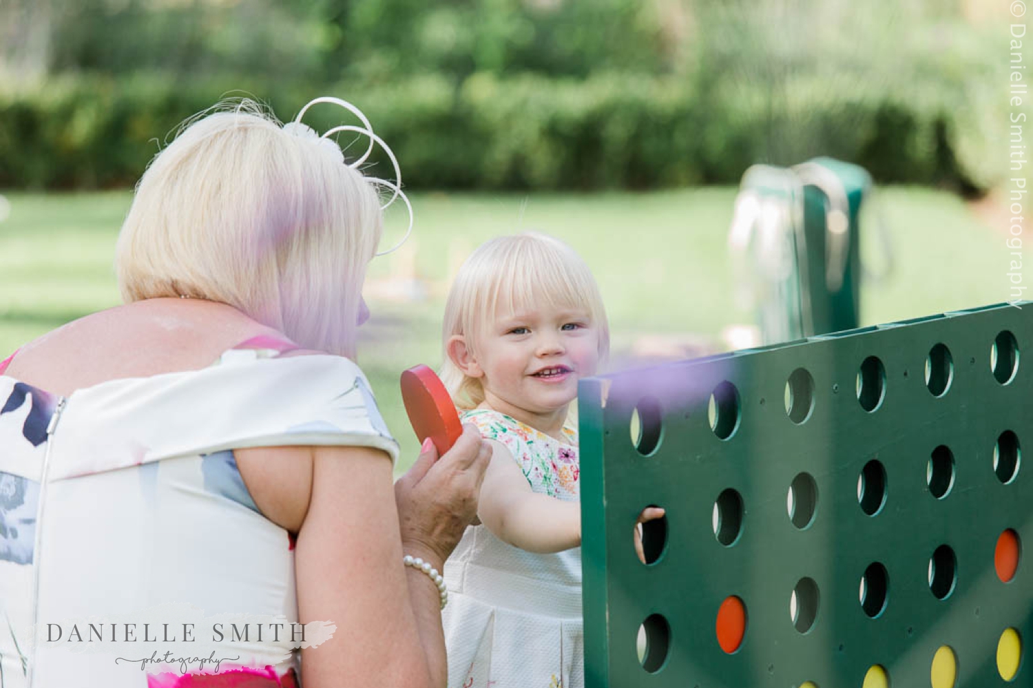 little girl playing giant connect 4