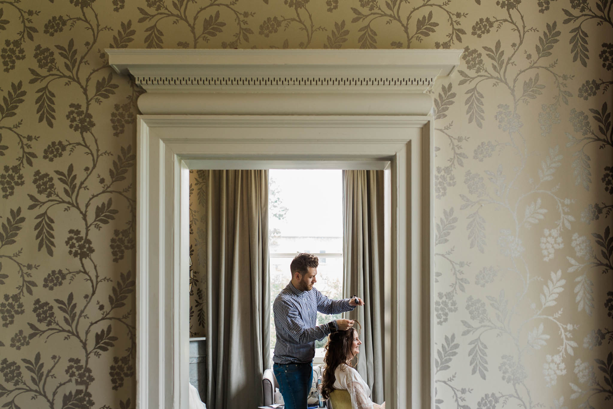 bride having her hair done at morden hall wedding
