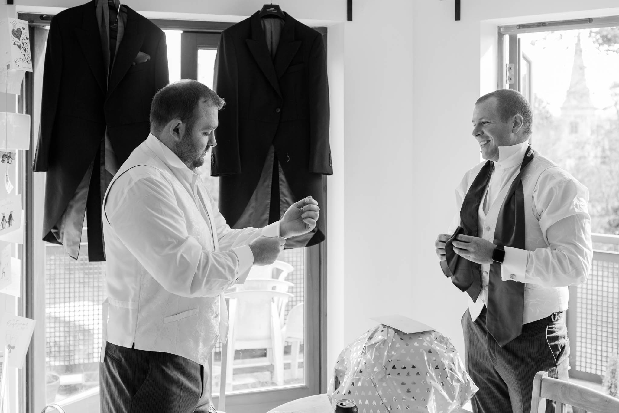 groom getting ready with usher