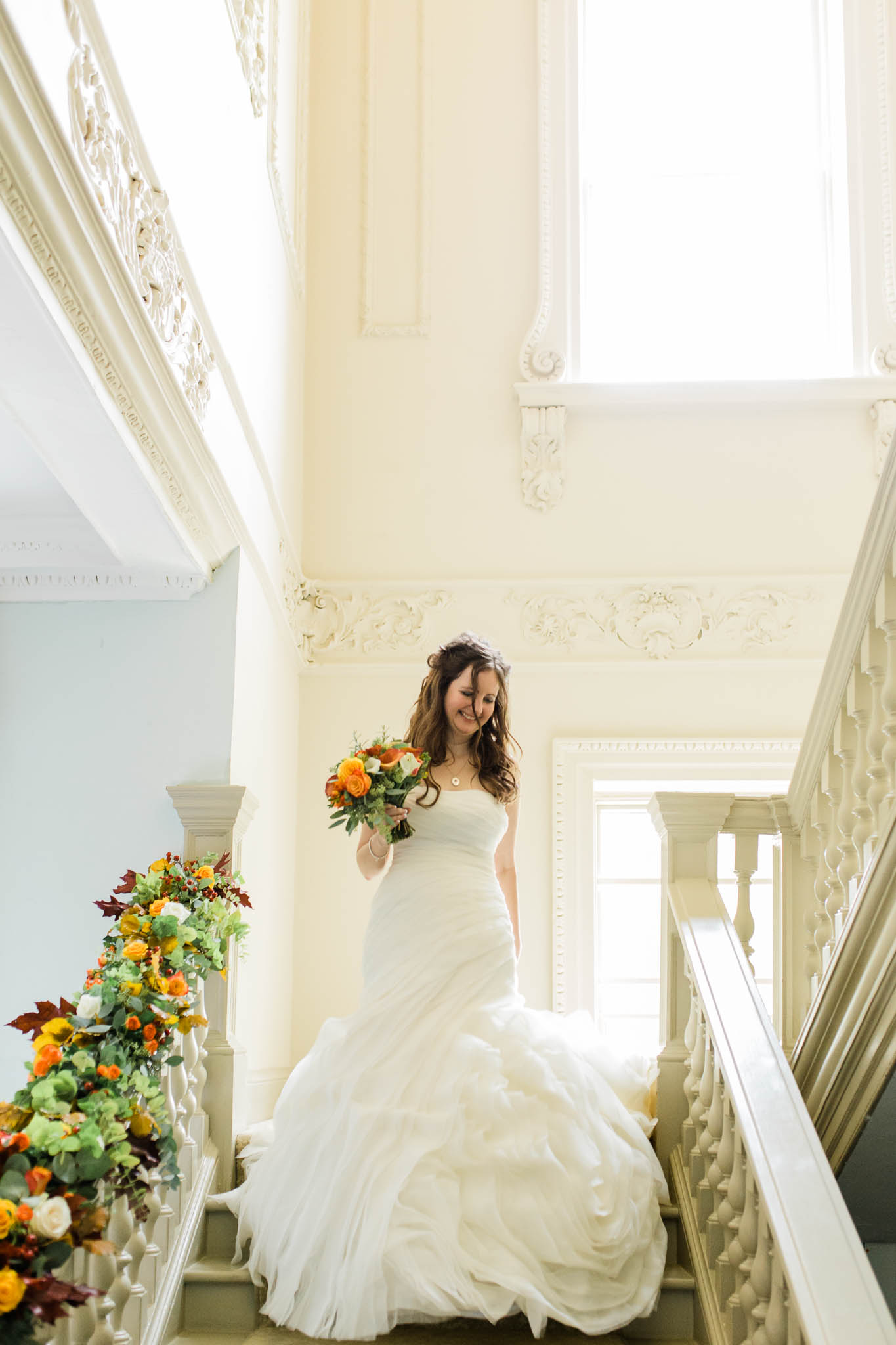 bride walking down stairs - autumn wedding