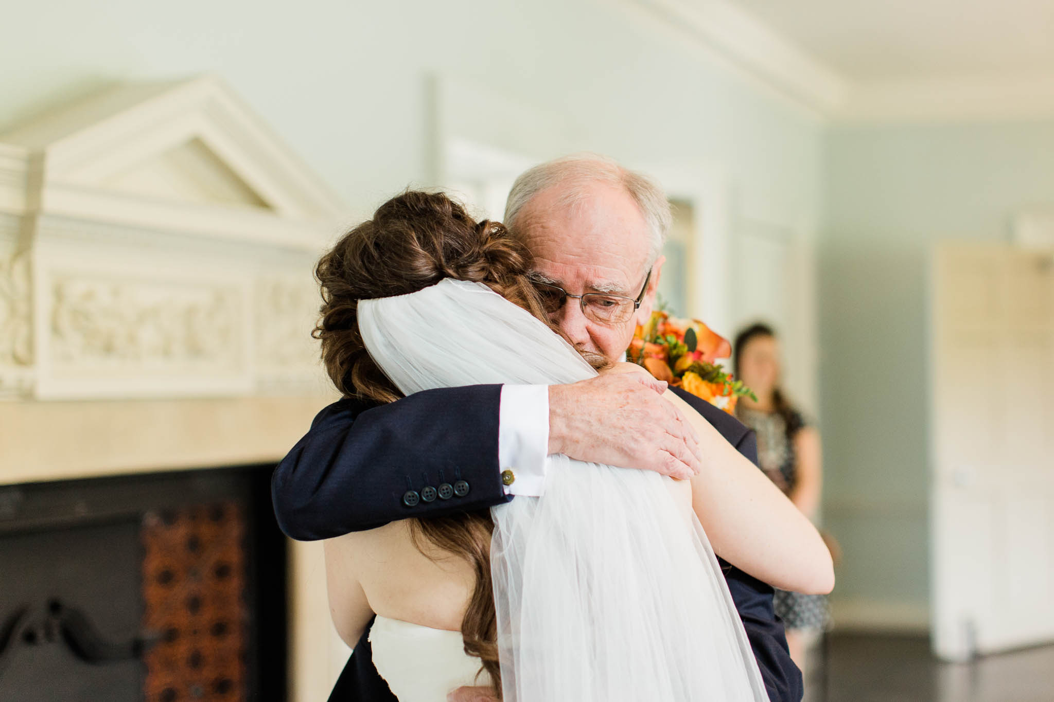 dad giving his daughter a cuddle