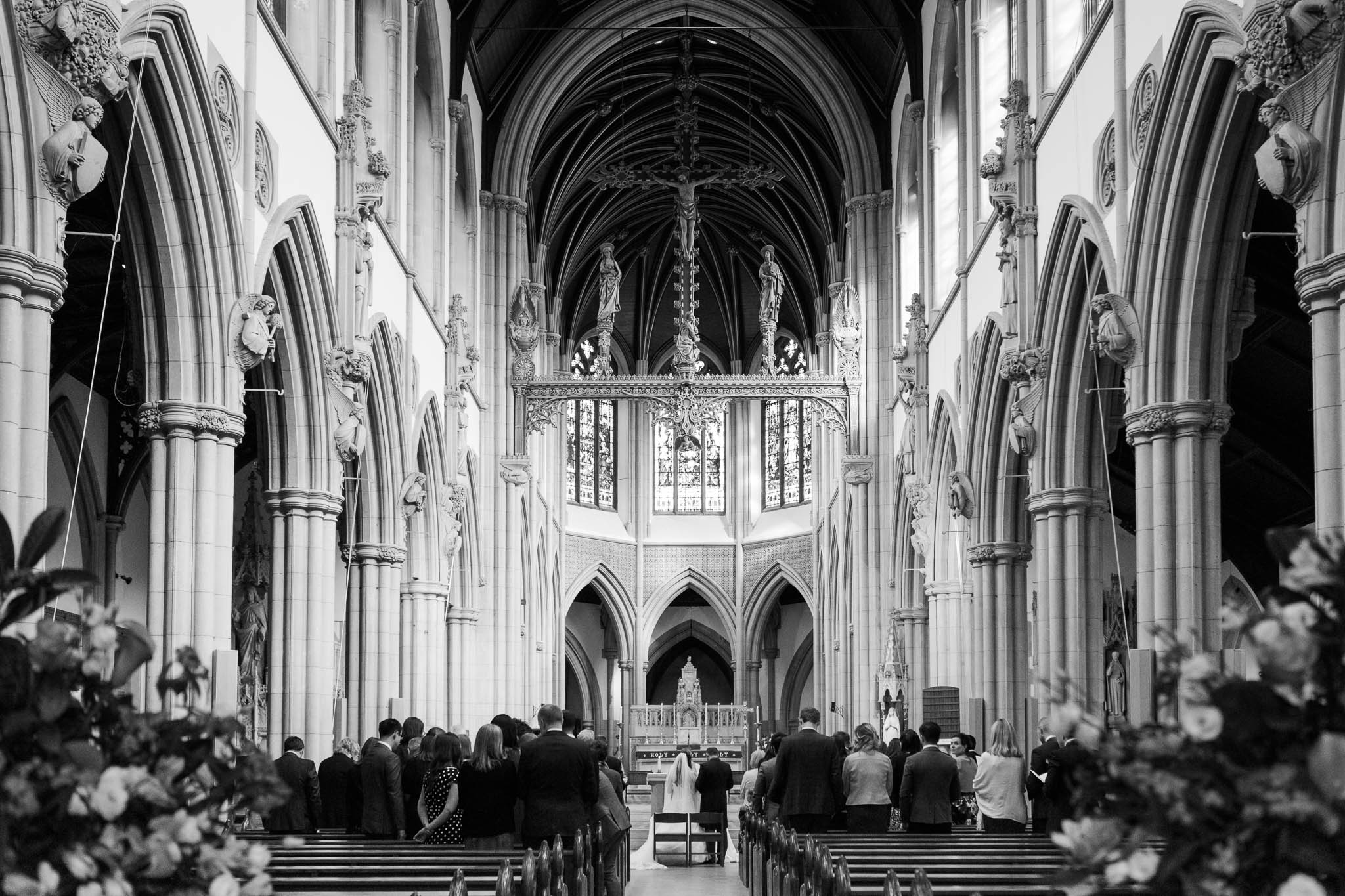bride and groom getting married in grand london church