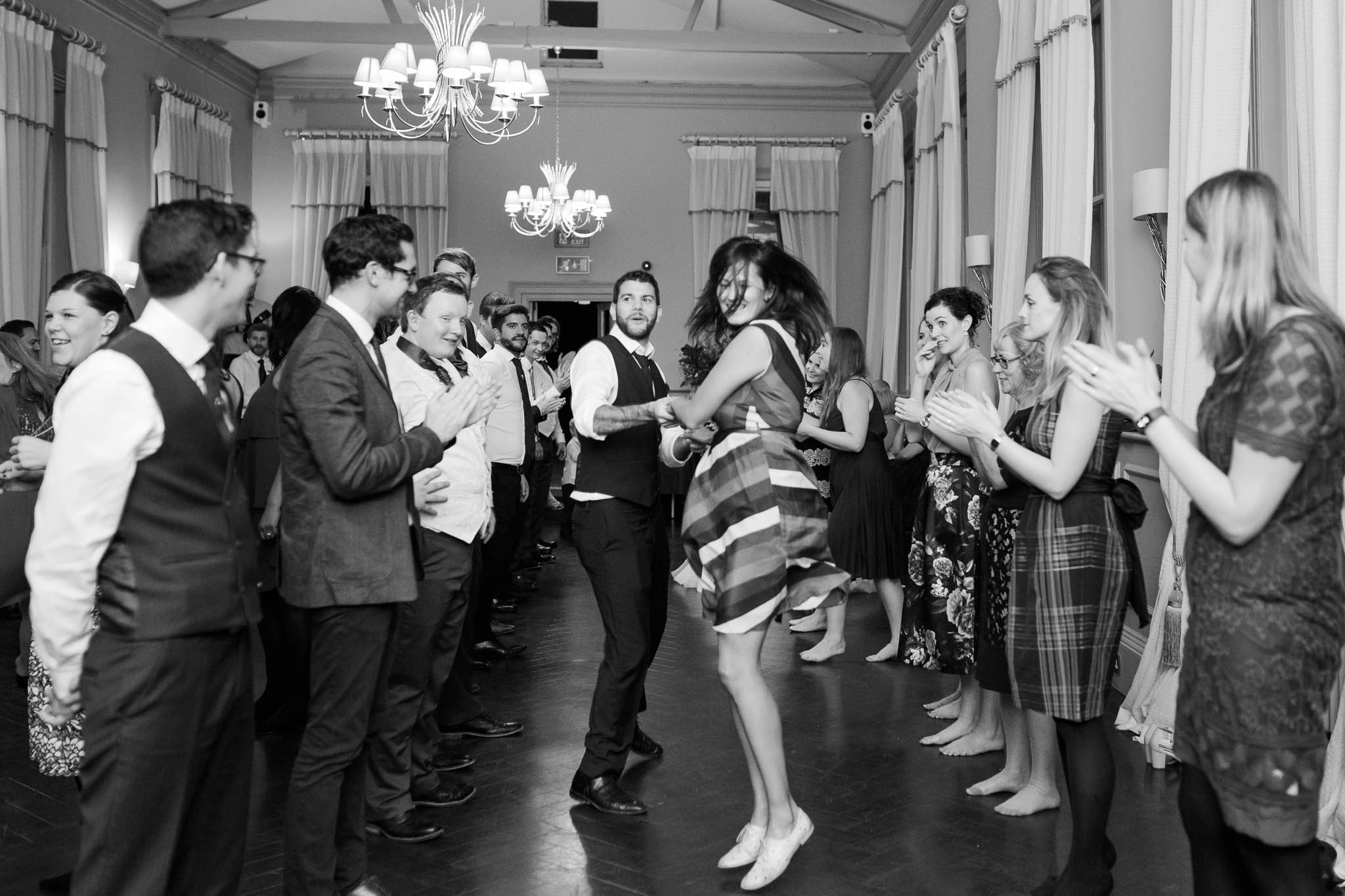 wedding guests dancing to ceilidh band - morden hall wedding