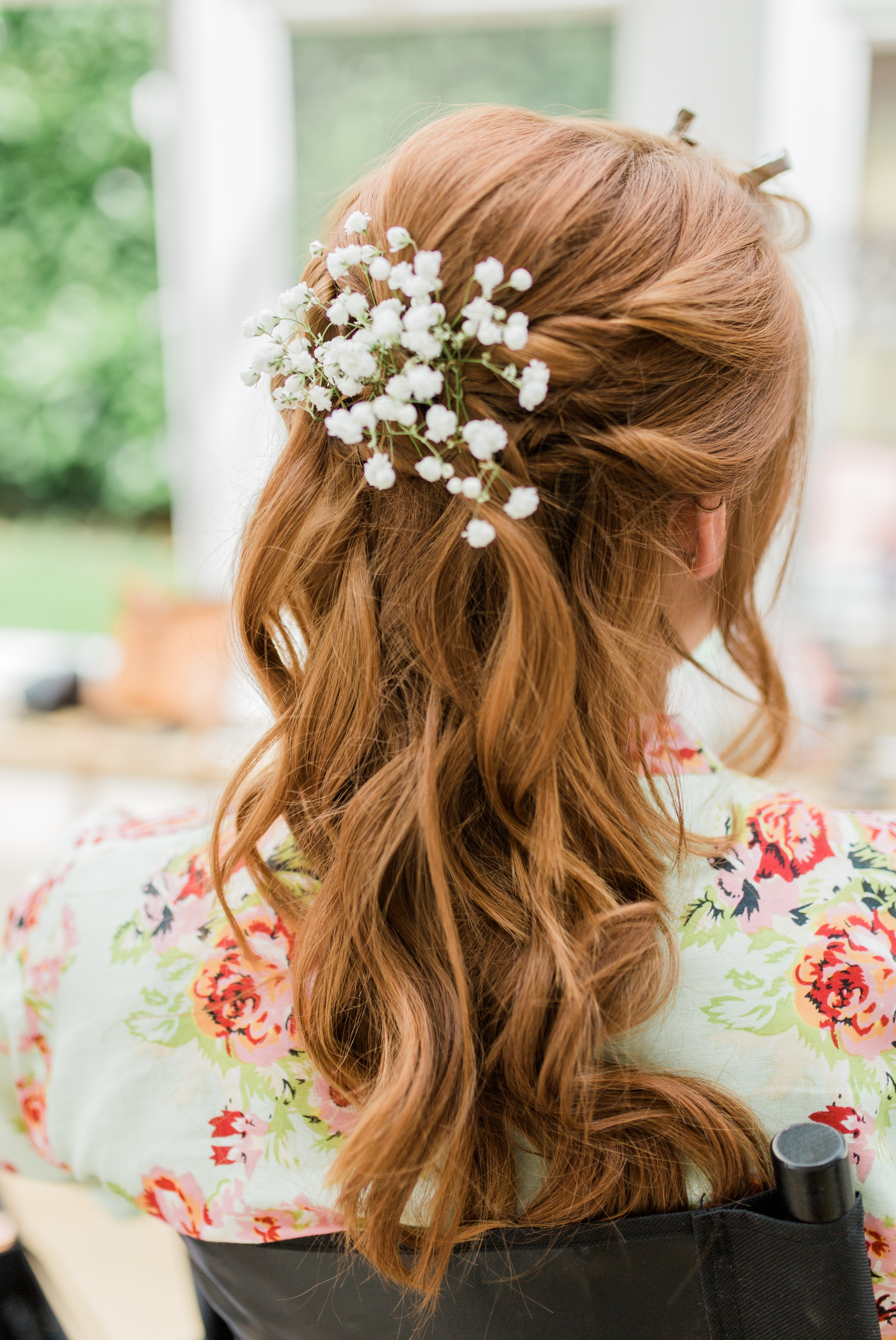 bridesmaid with ginger hair and gypsophila