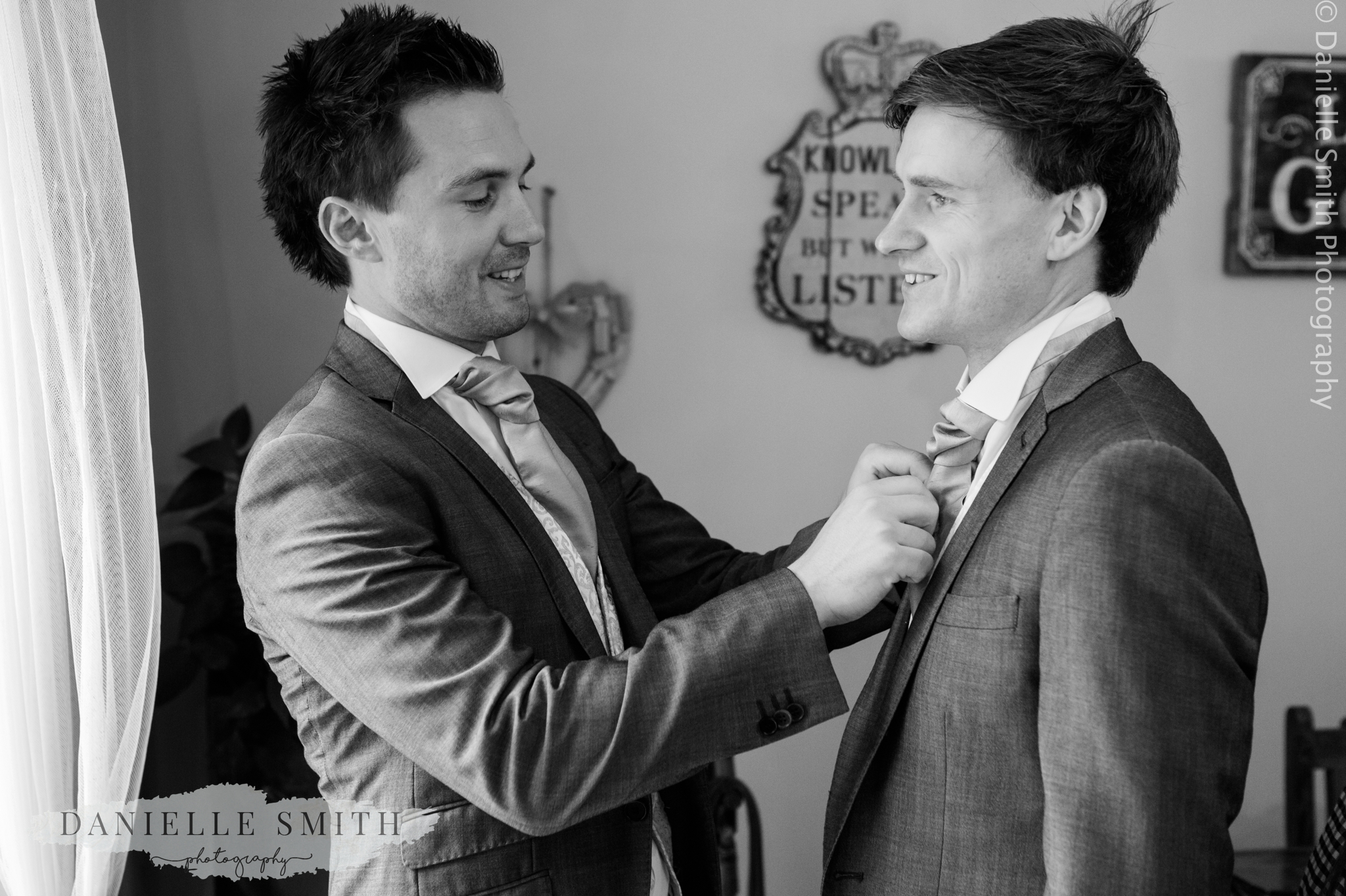 best man helping groom get ready - relaxed marquee wedding