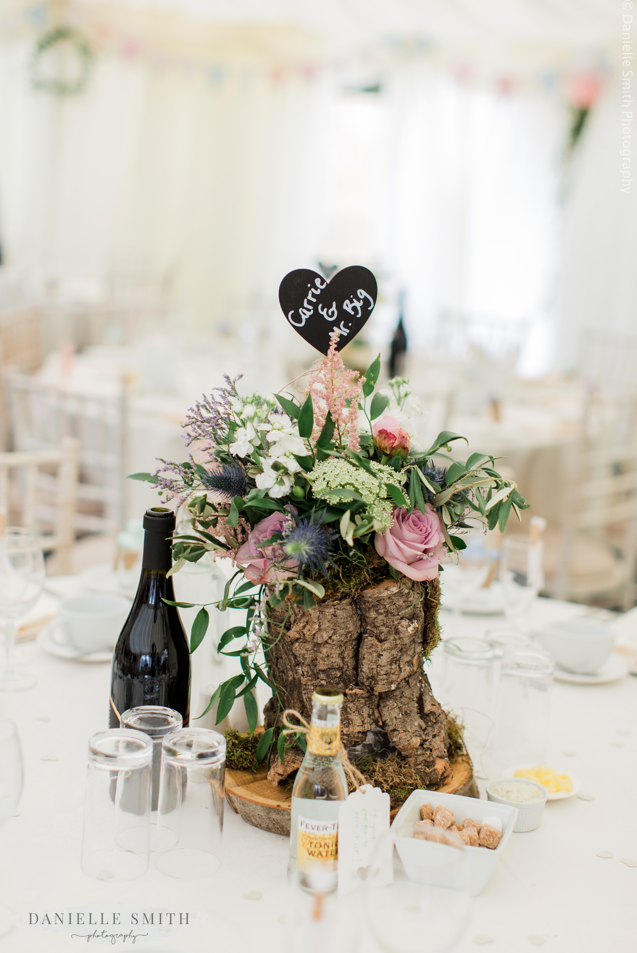 tree trunk centre piece with flowers