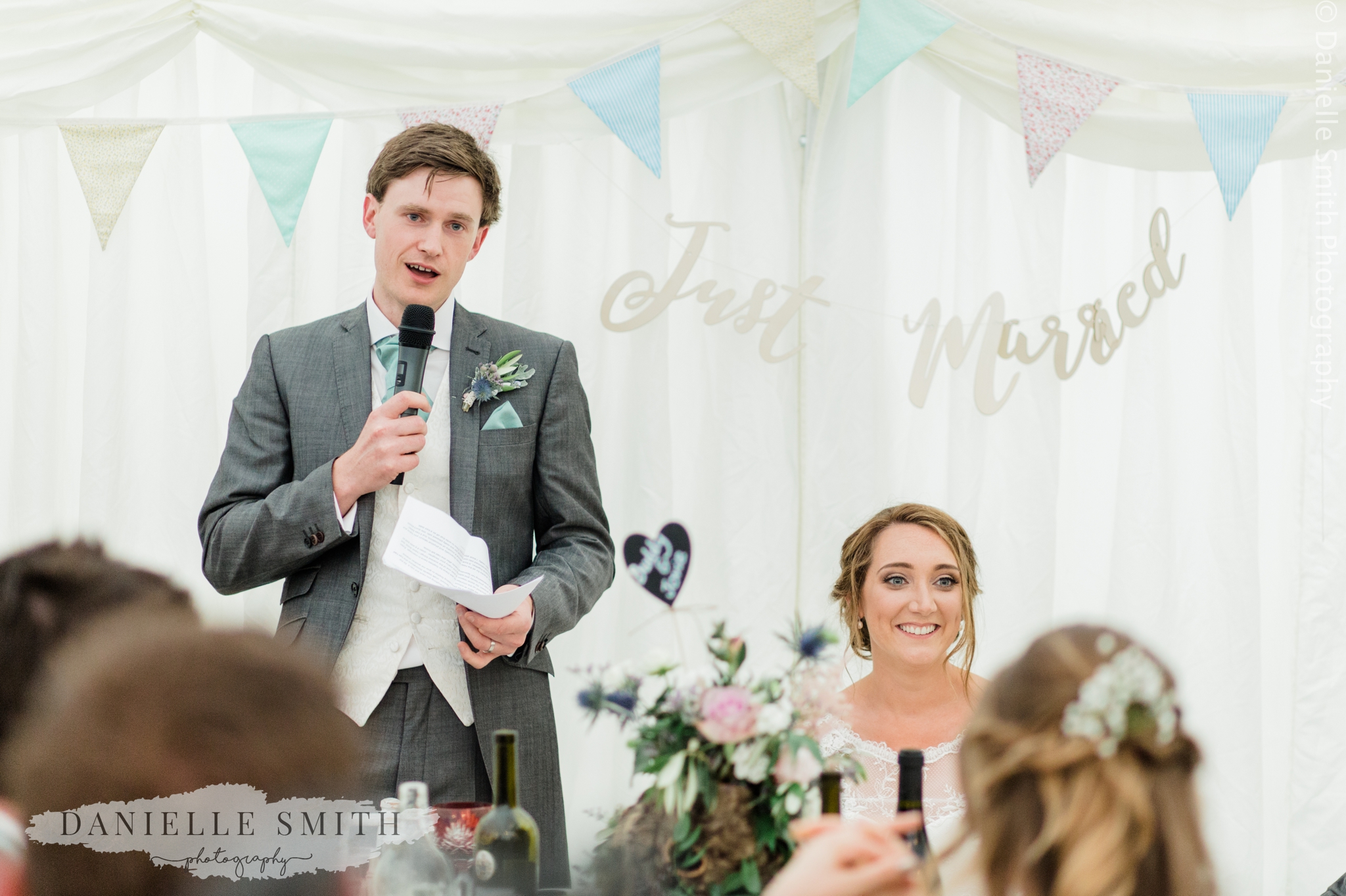 groom giving speech at marquee wedding