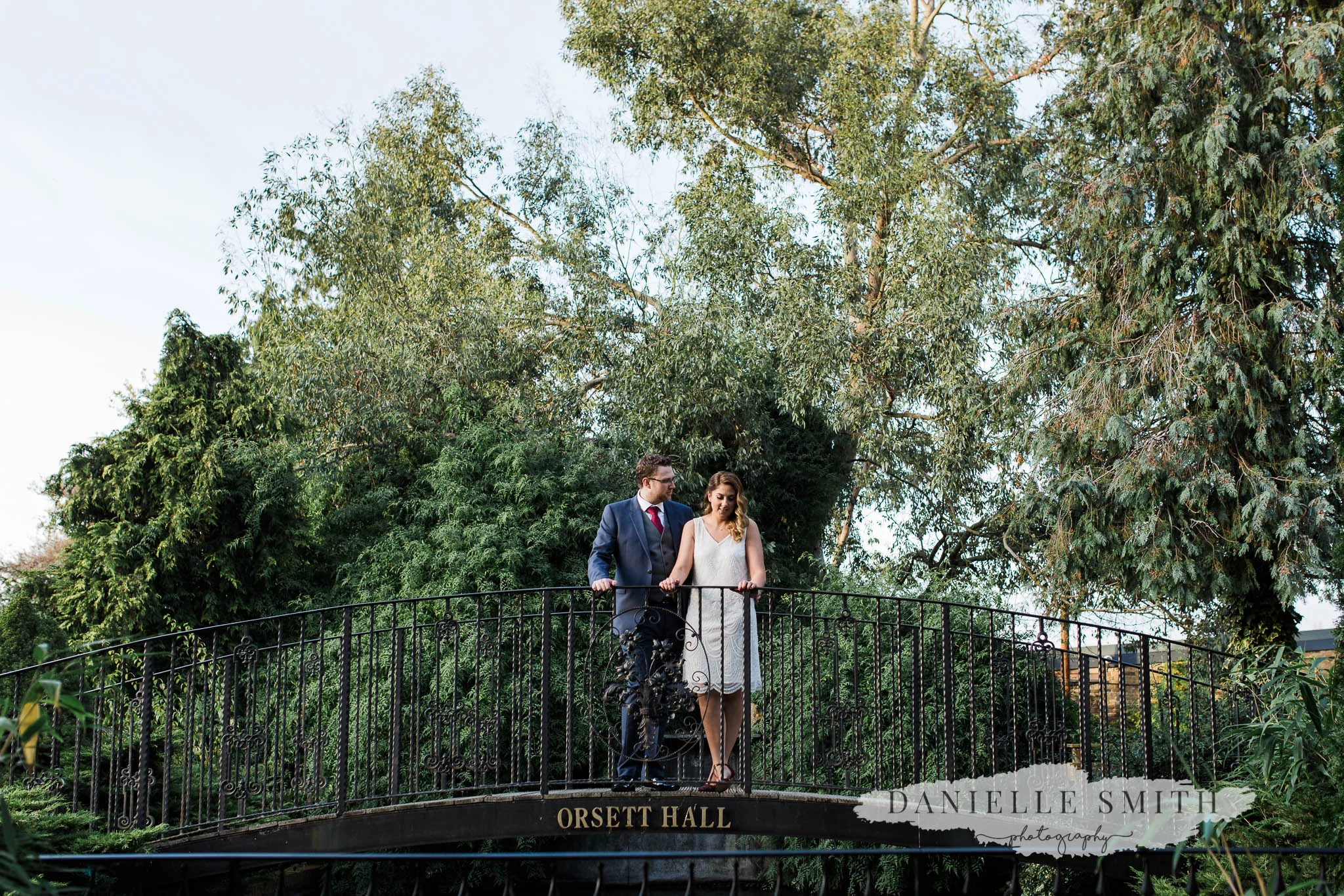 couple portrait on bridge at orsett hall