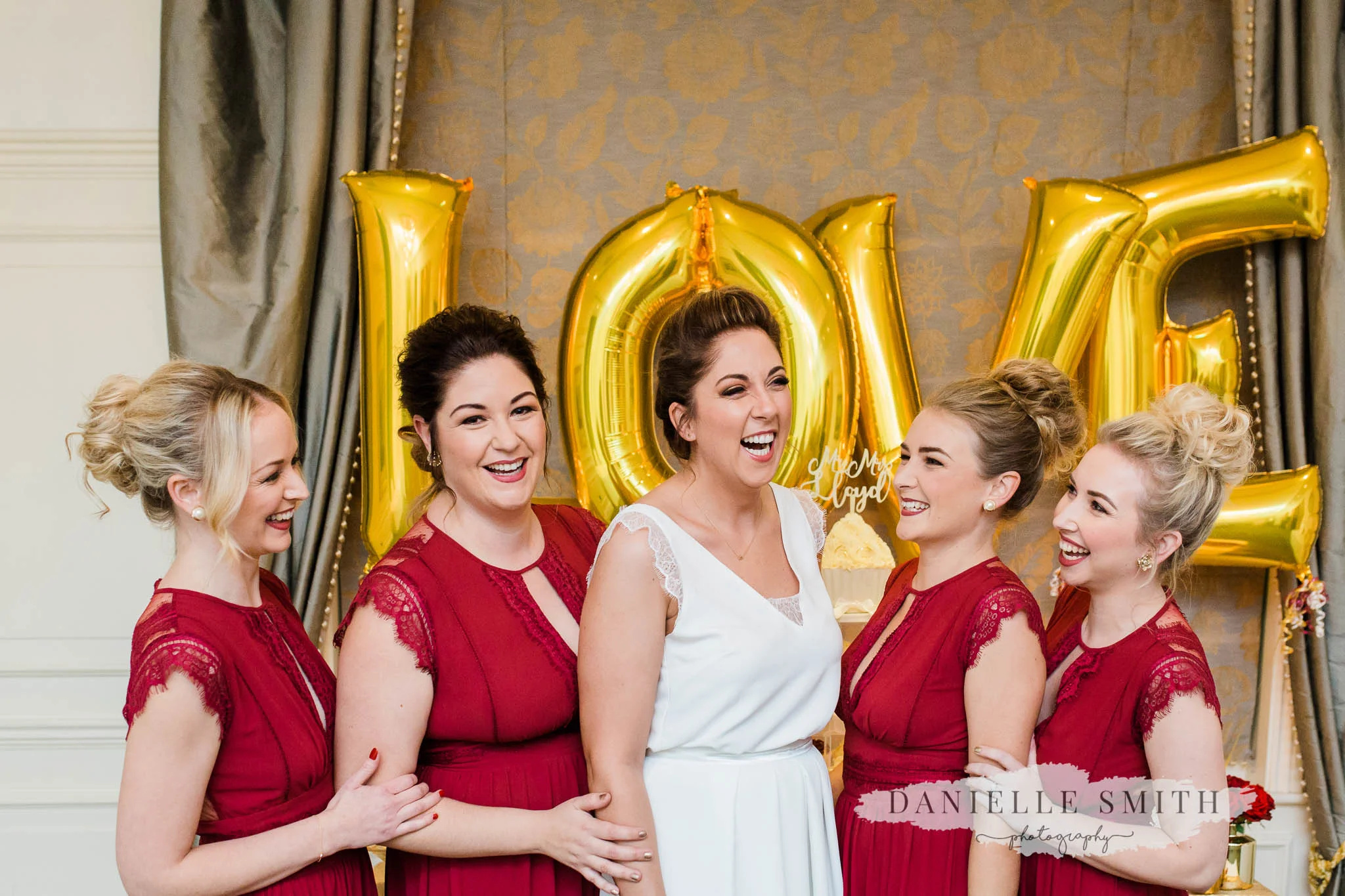 bride and bridesmaids laughing