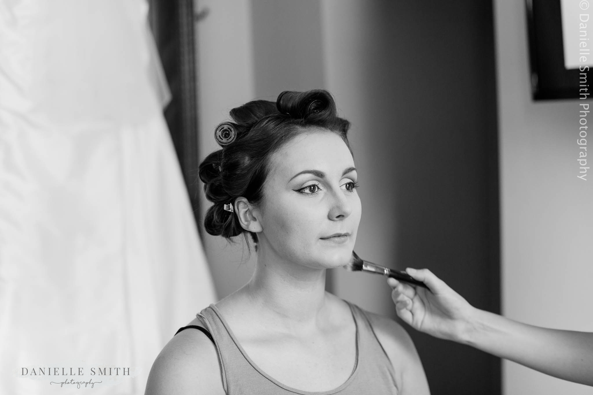 bridesmaid having her make up done
