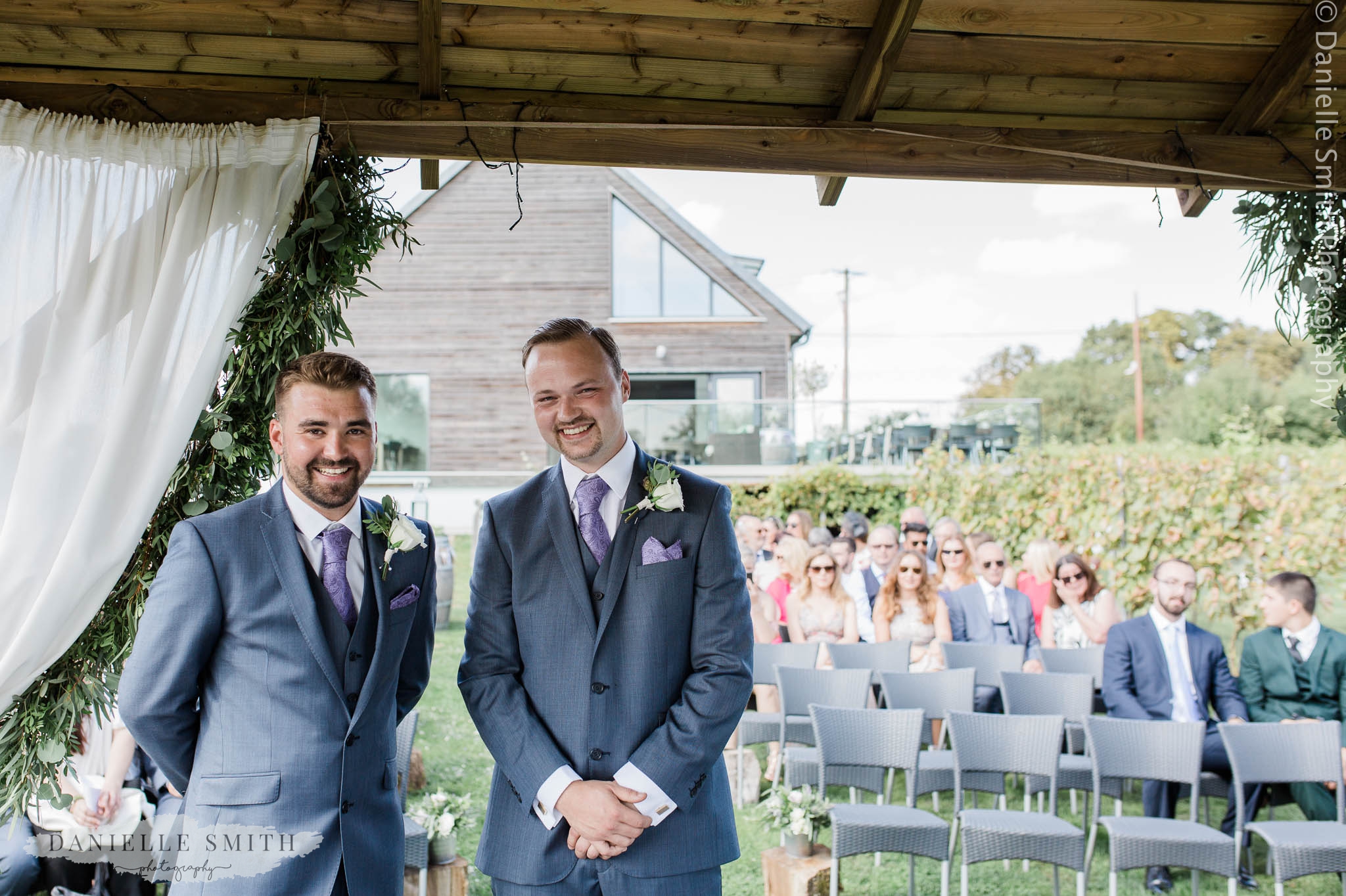 groom and best man waiting for bride to walk down aisle