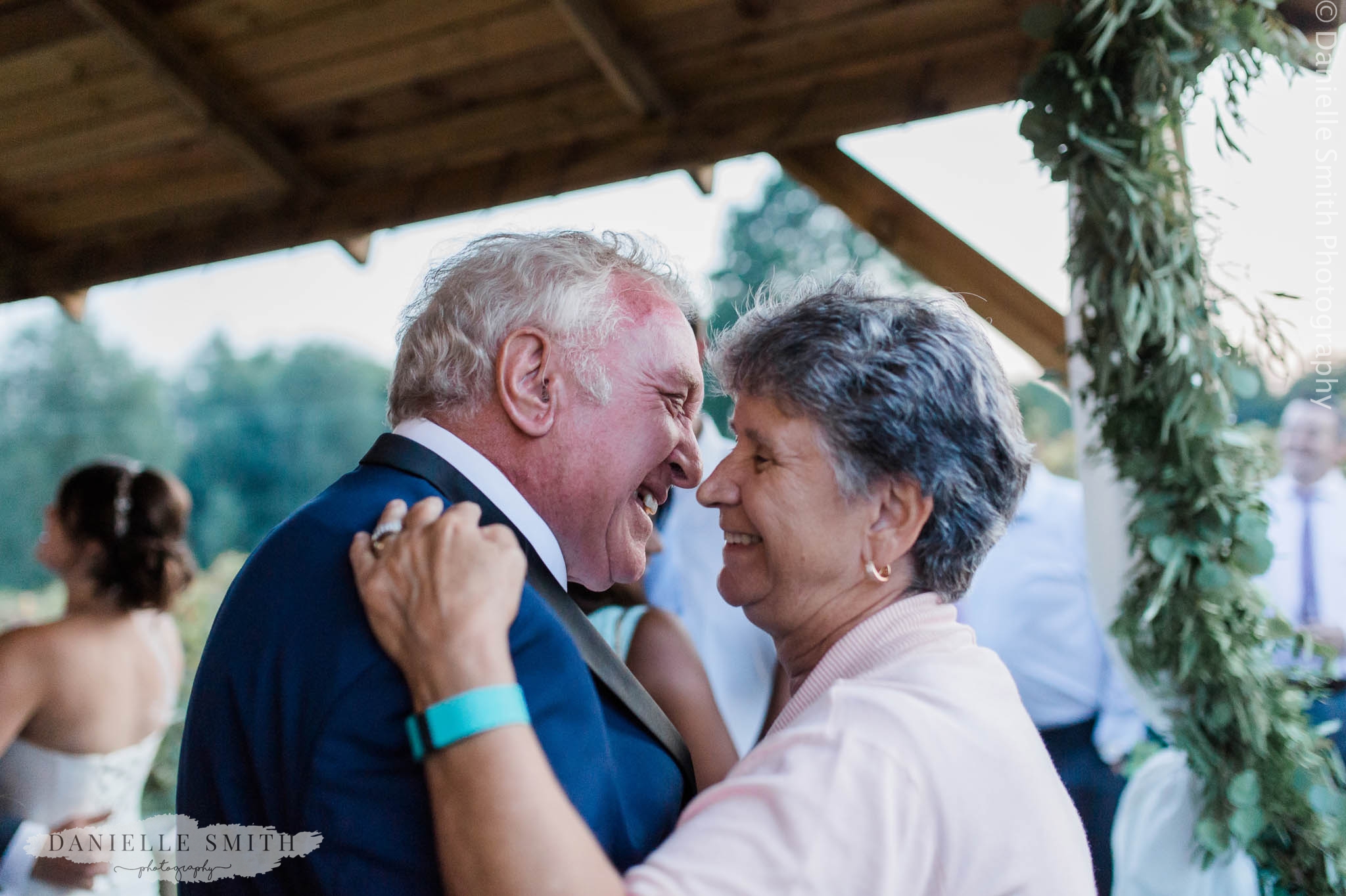 nan and granddad dancing at outdoor wedding
