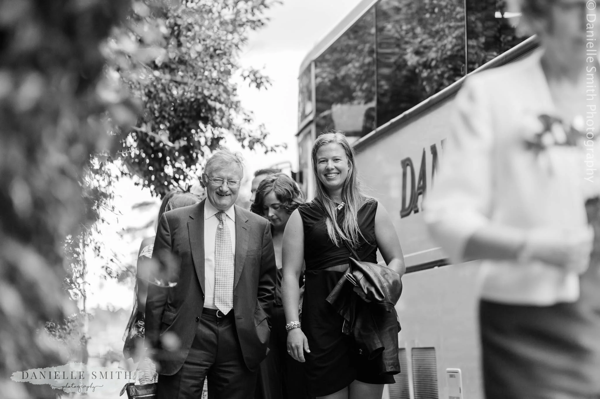 wedding guests getting off coach