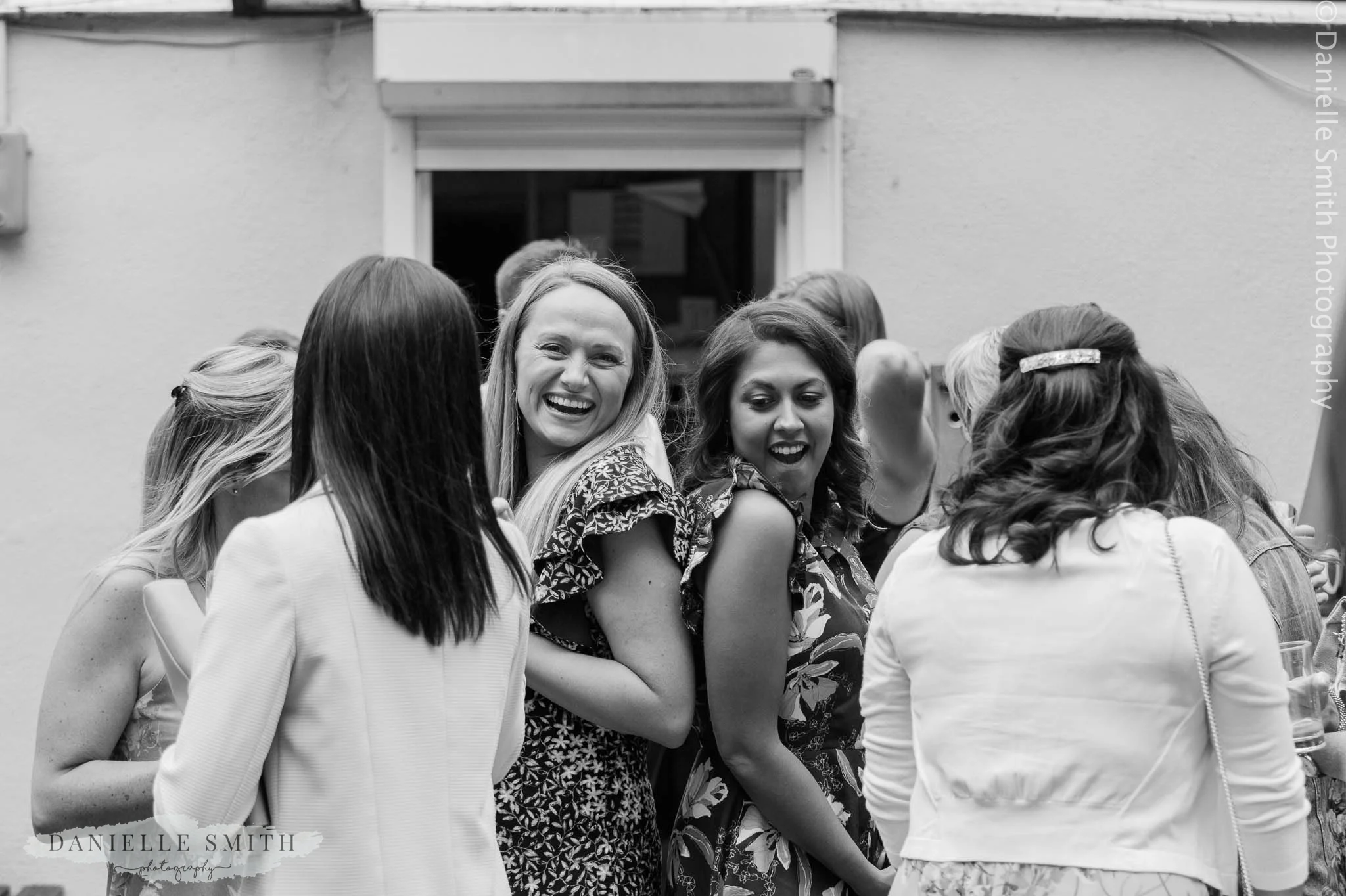 girls having fun at wedding - bowls club wedding