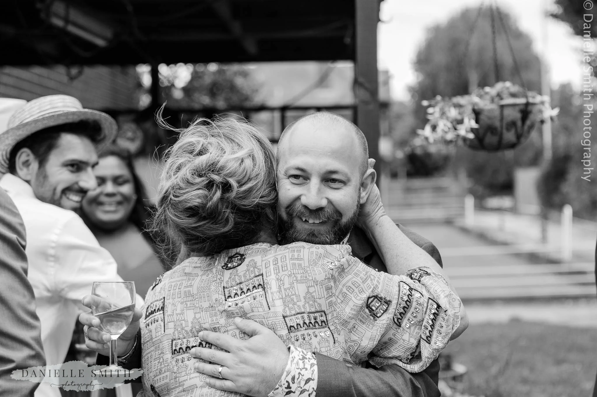 groom hugging new mother in law - bowls club wedding