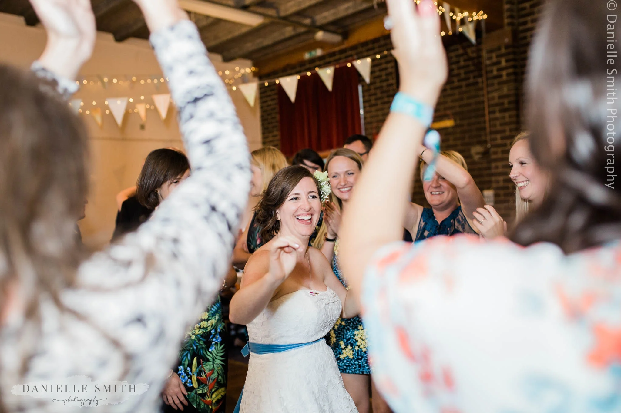 bride dancing with her friends