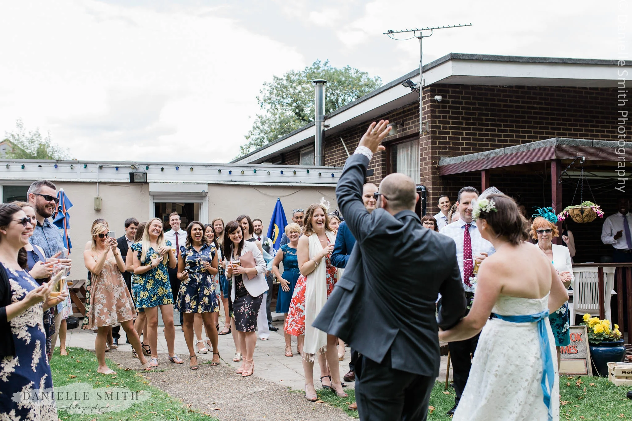 wedding guests cheering bride and groom - east london wedding