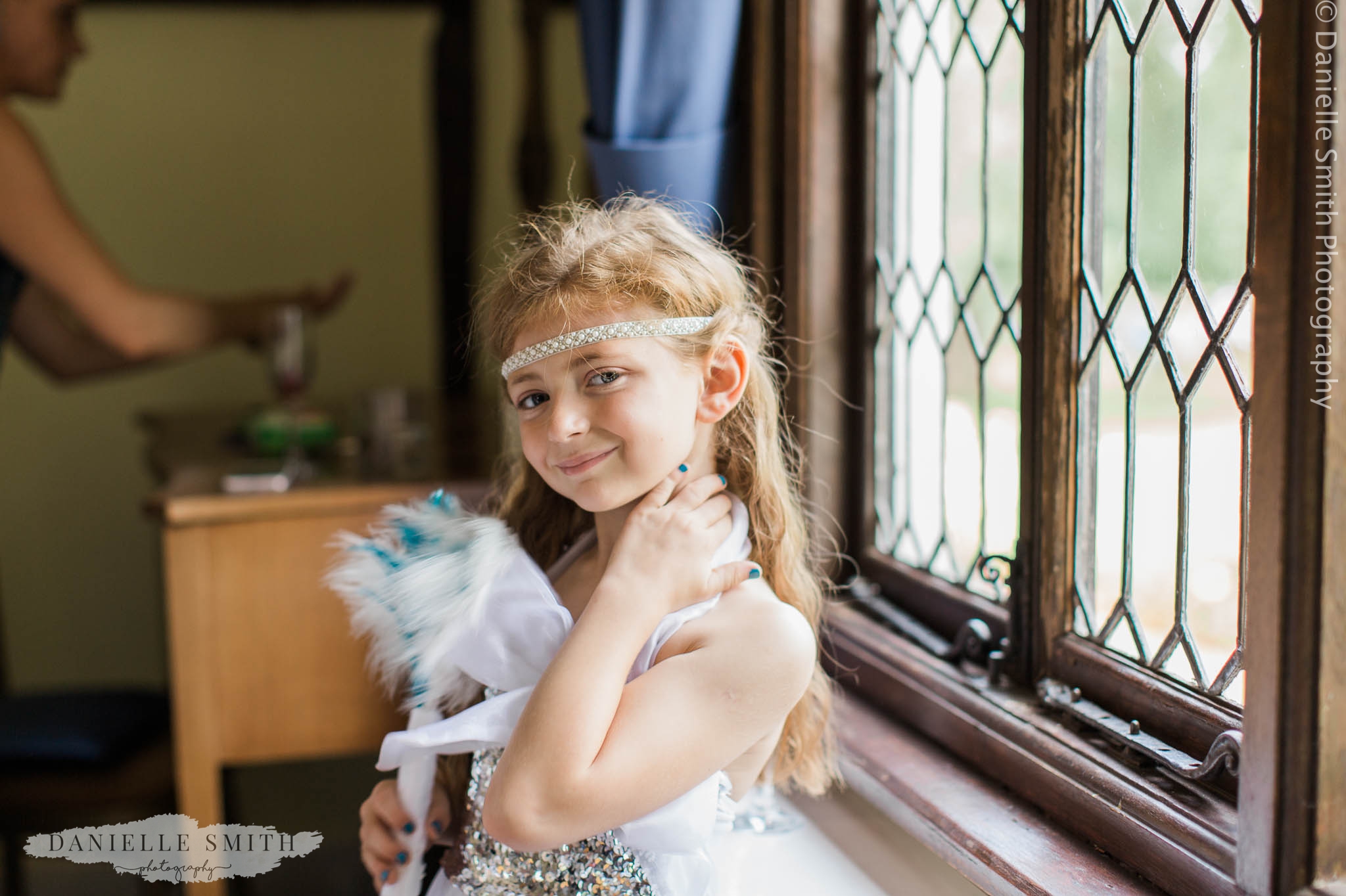 flower girl with feather bouquet - gatsby wedding