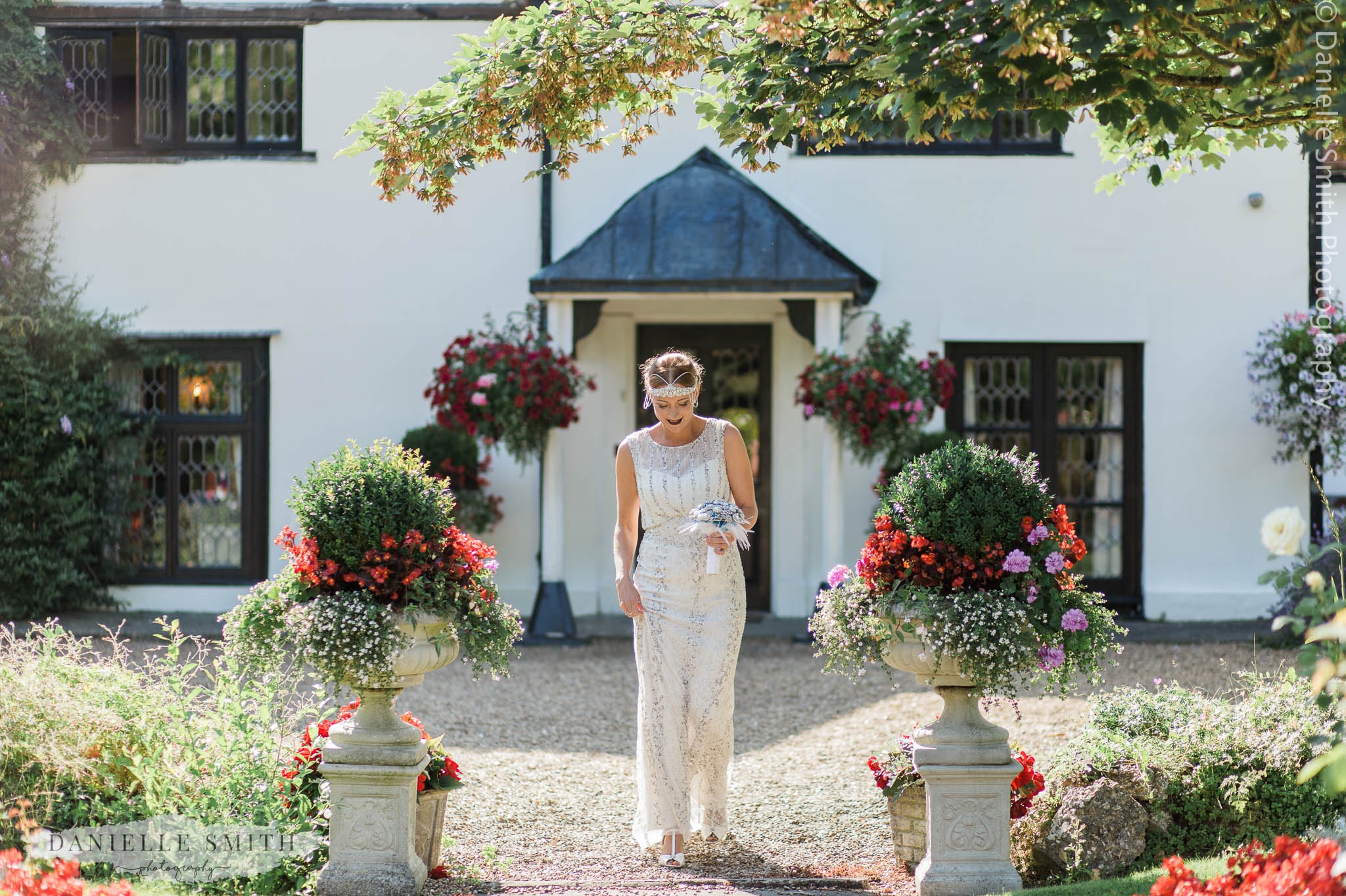 gatsby styled bride walking down aisle