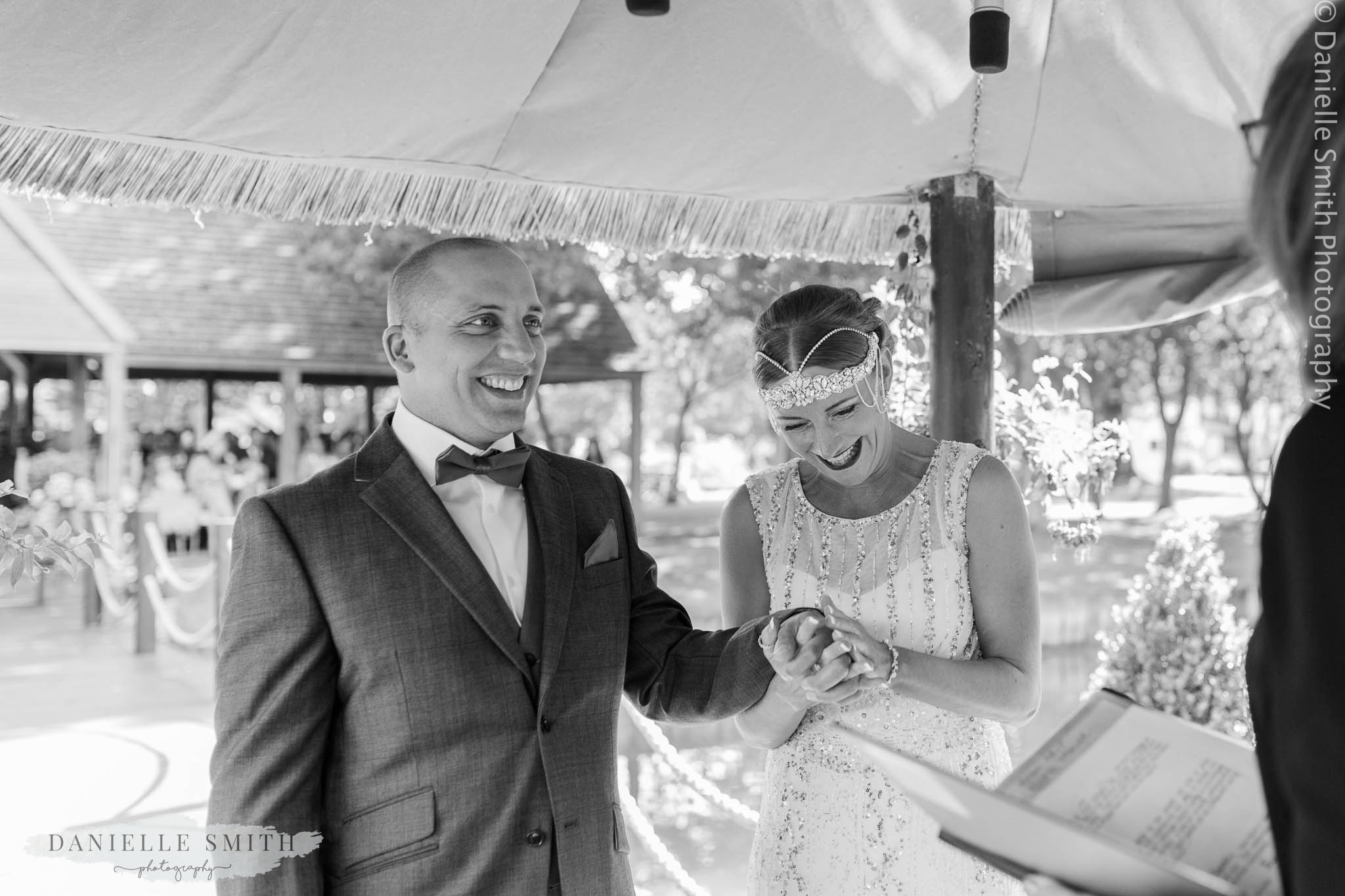 bride and groom laughing during vows - mangapp manor wedding