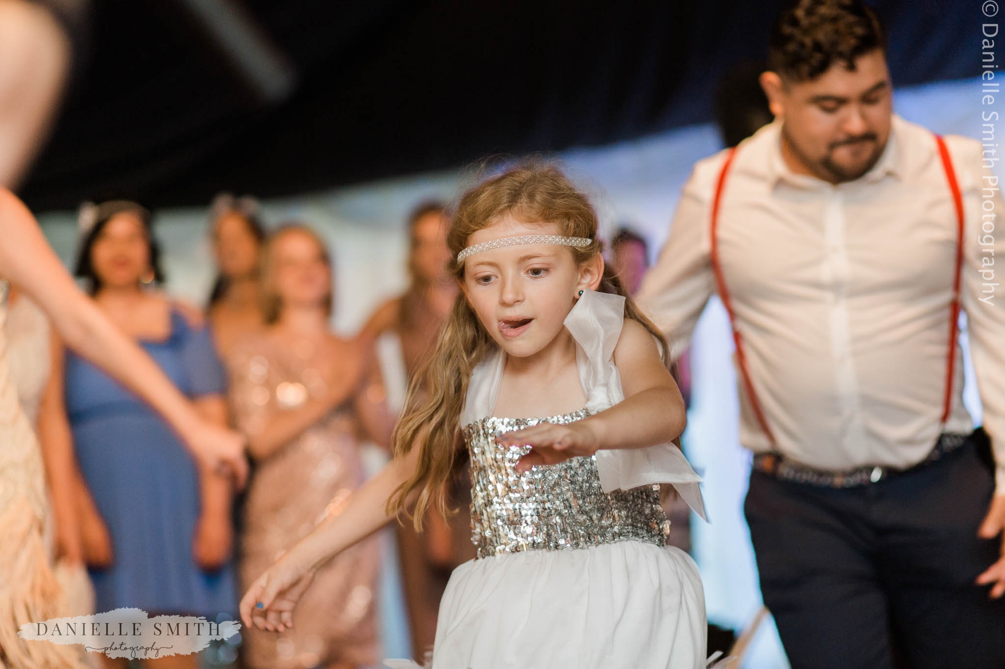 flower girl dancing at wedding