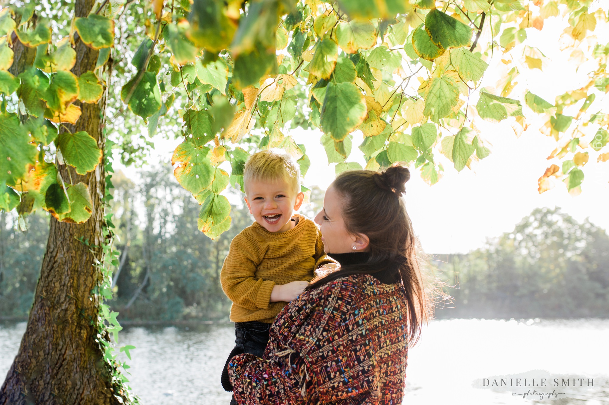 son laughing with his mum during photo shoot