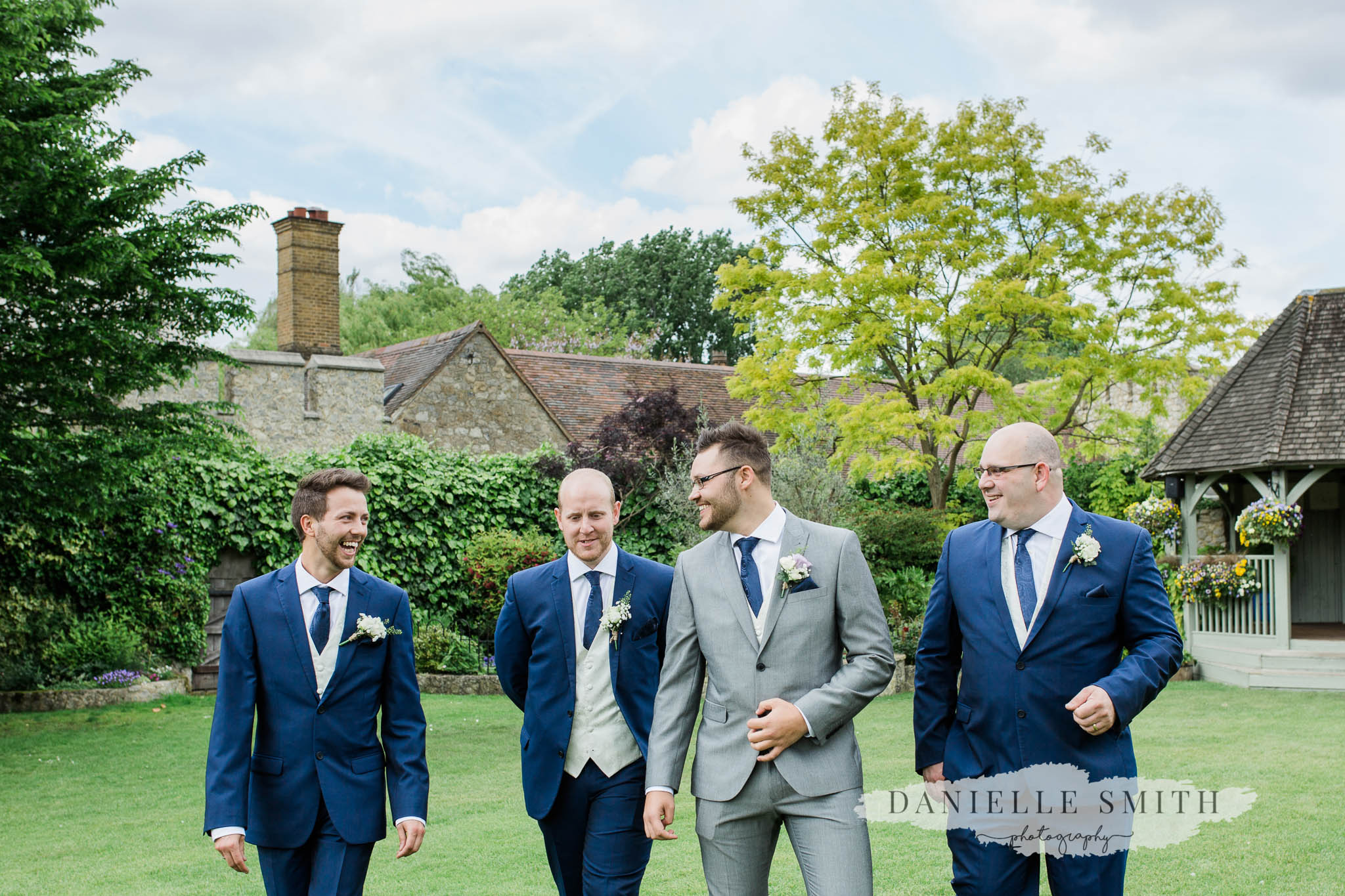 groom and groomsmen in the gardens