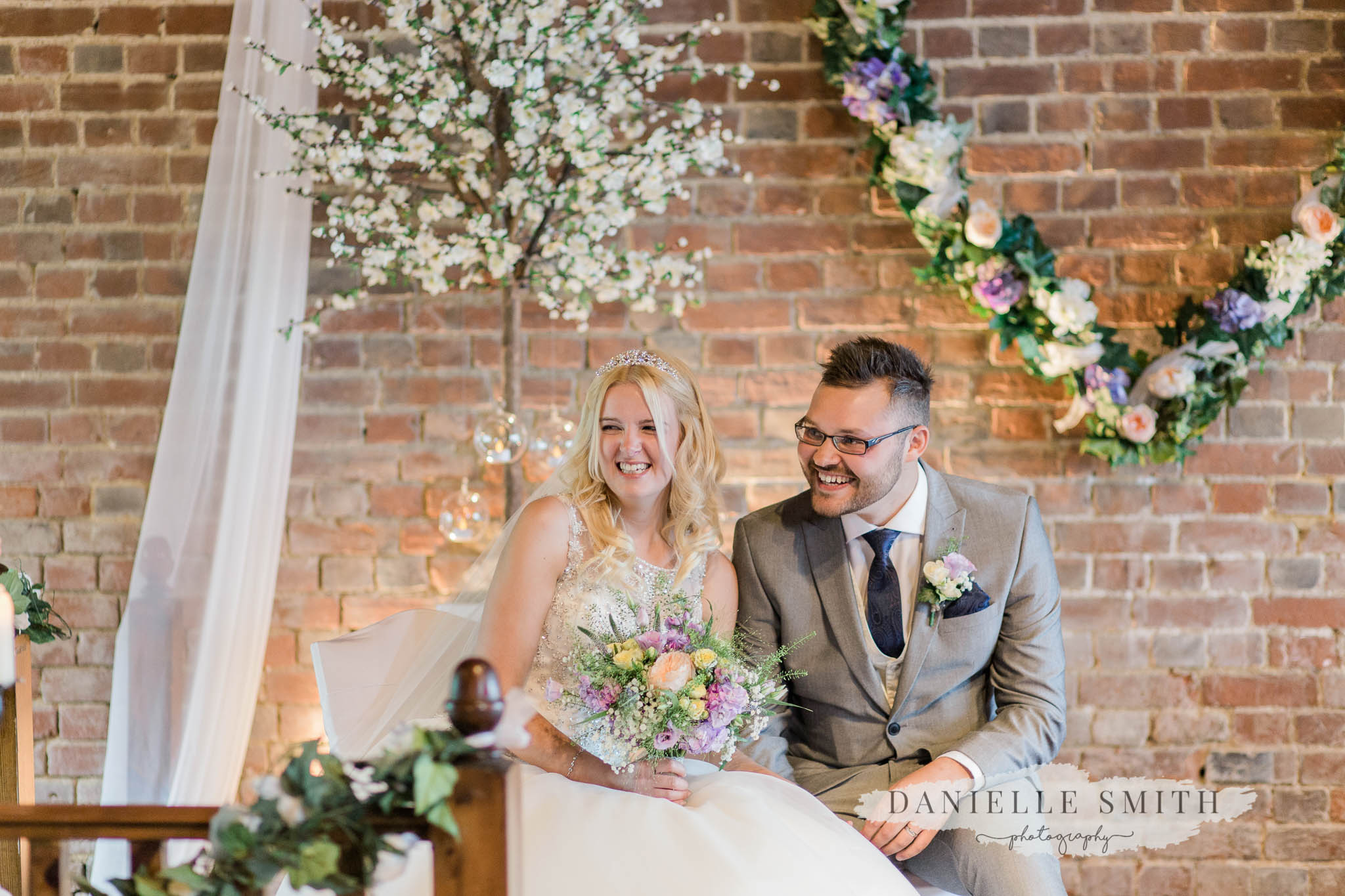 bride and groom laughing at cooling castle barn