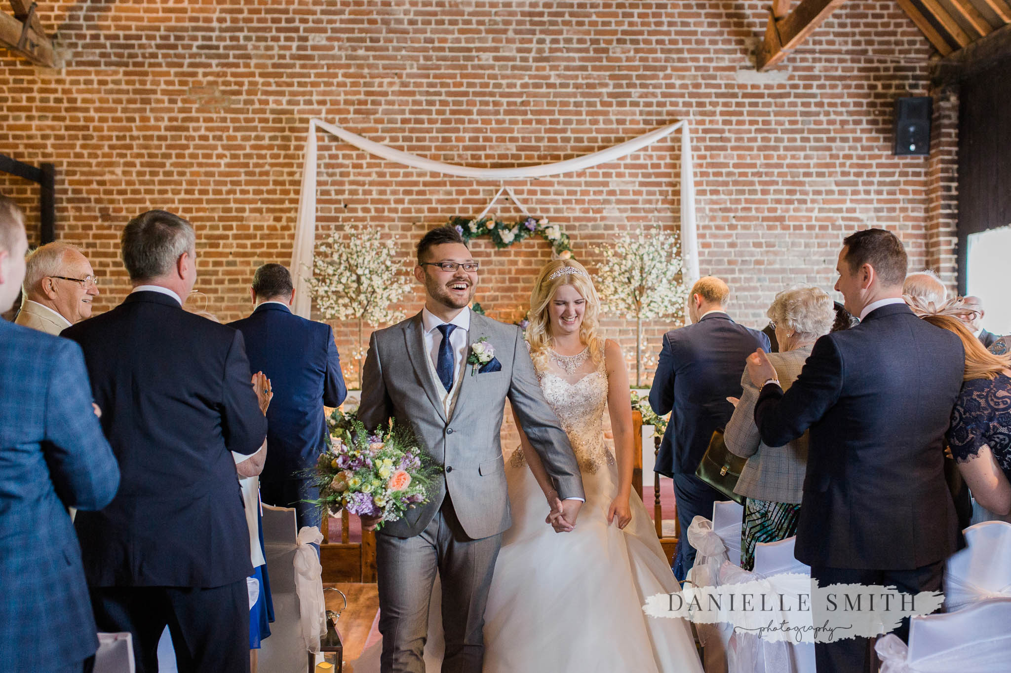 just married walking down the aisle - kent wedding photography