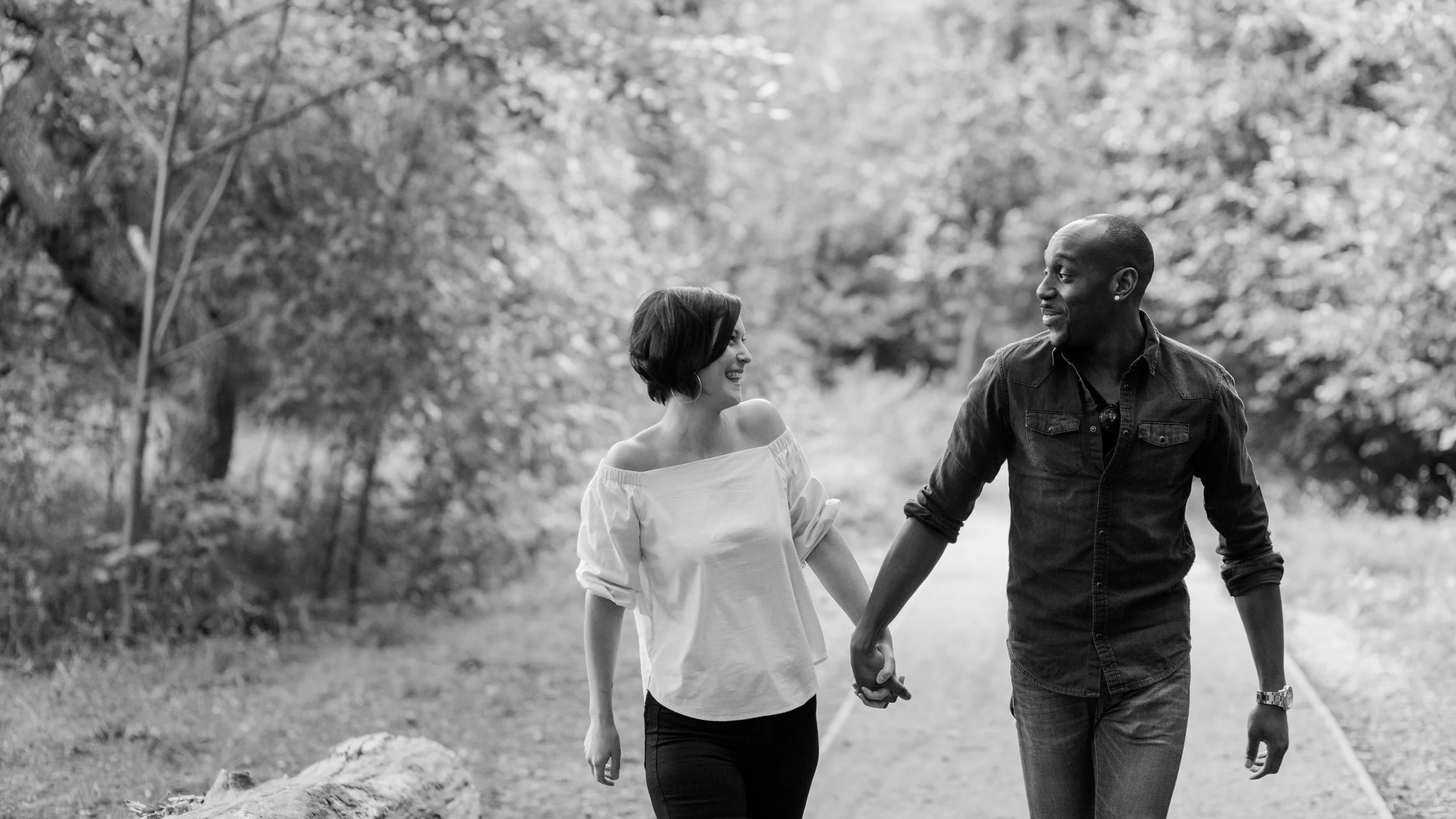 couple holding hands and walking