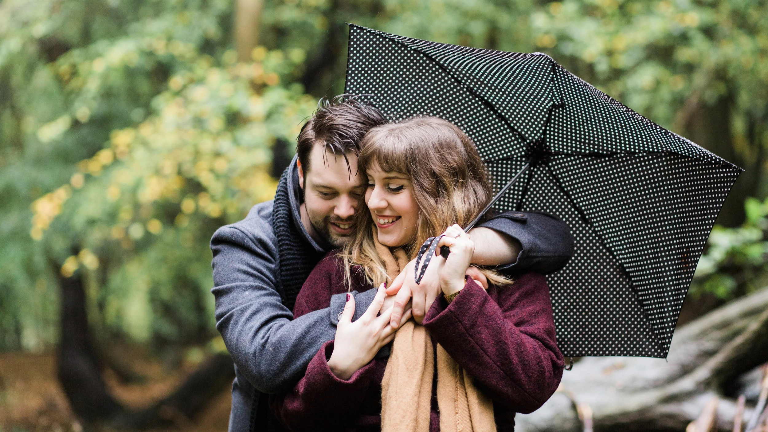 couple hugging in forest