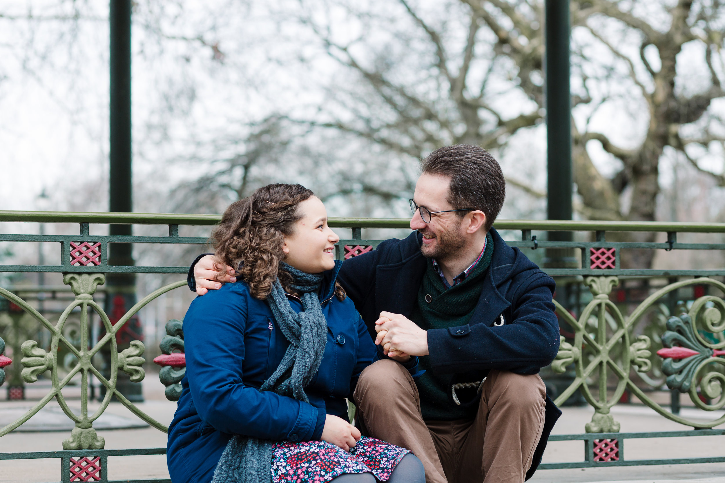 couple sitting by band stand - pre-wedding photography battersea park