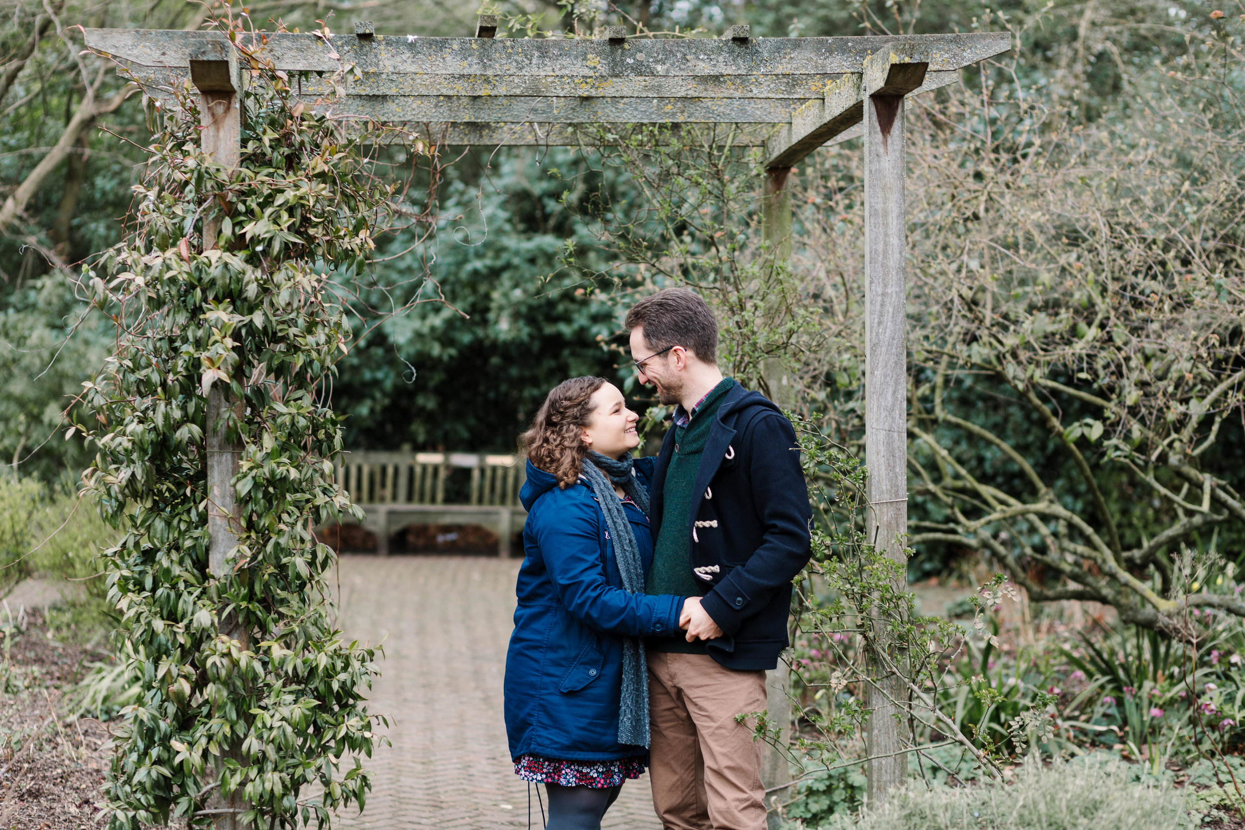 couple standing under pergola in battersea park