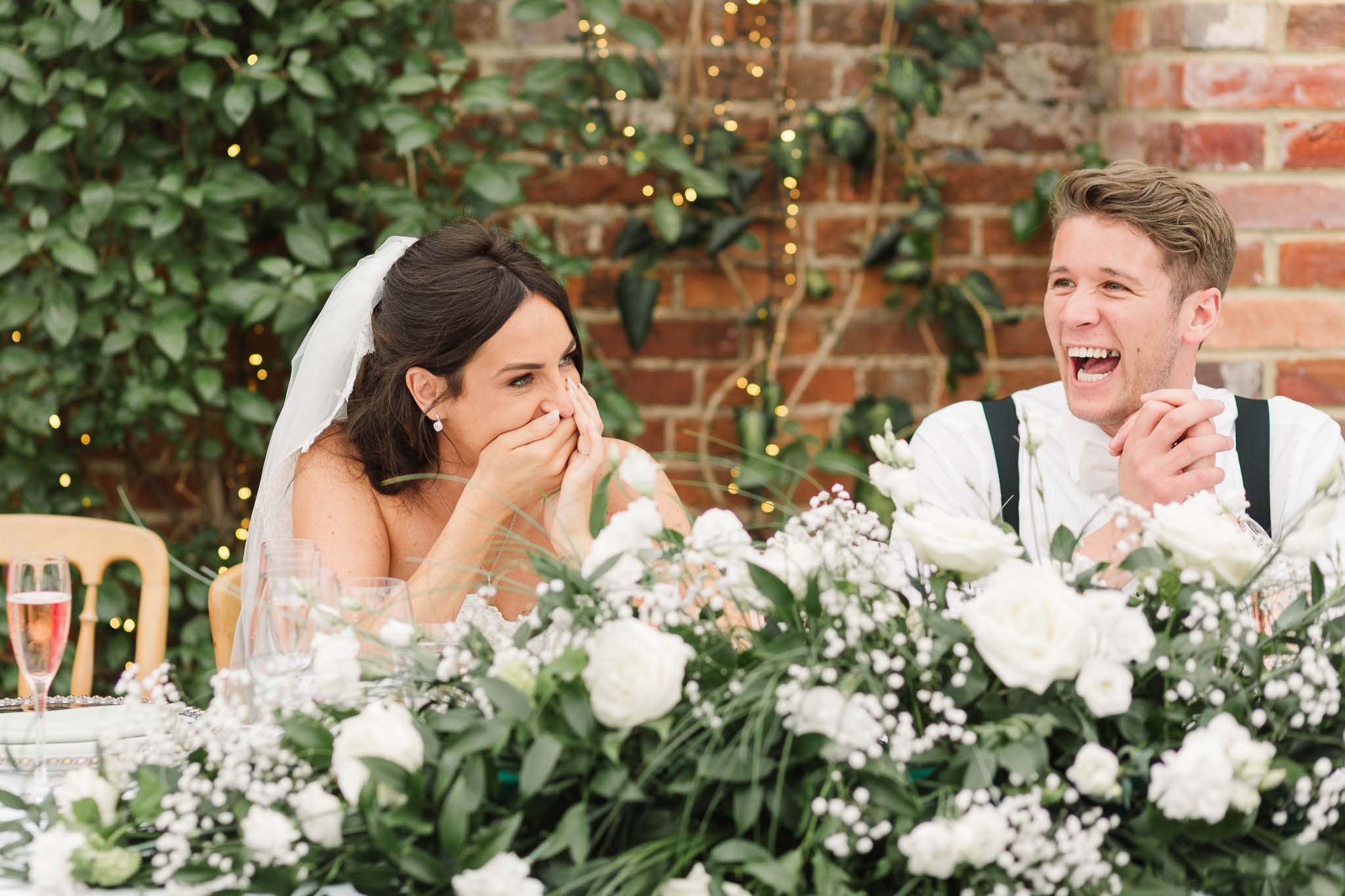 bride and groom laughing at speeches - elegant and stylish wedding