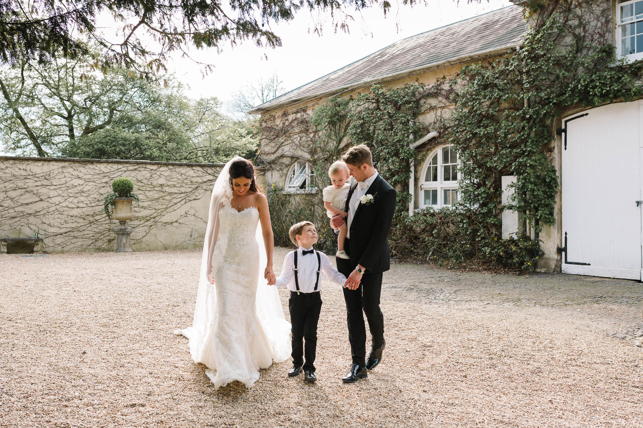 bride and groom with 2 children