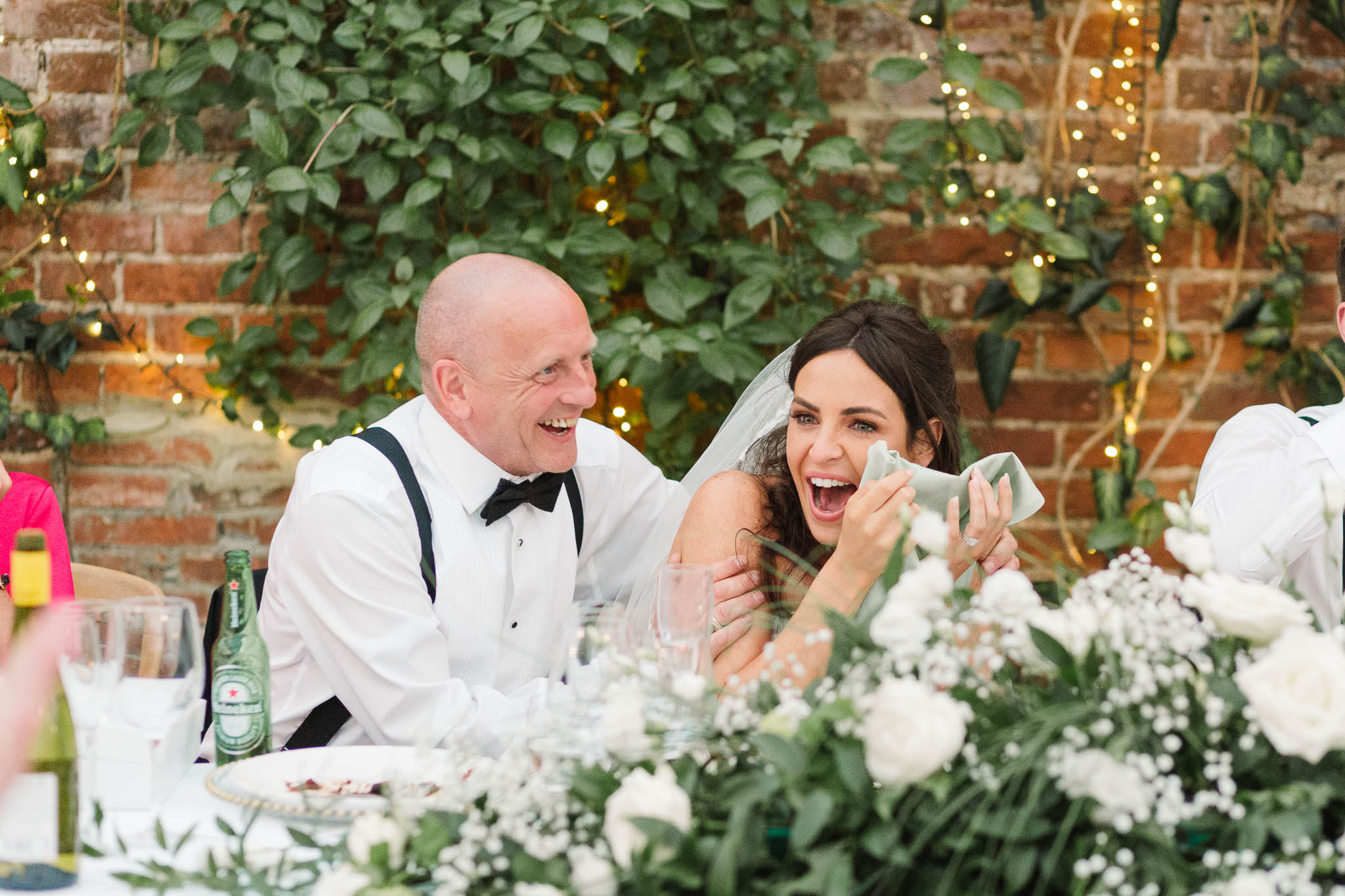 bride embarrassed with dad during speeches