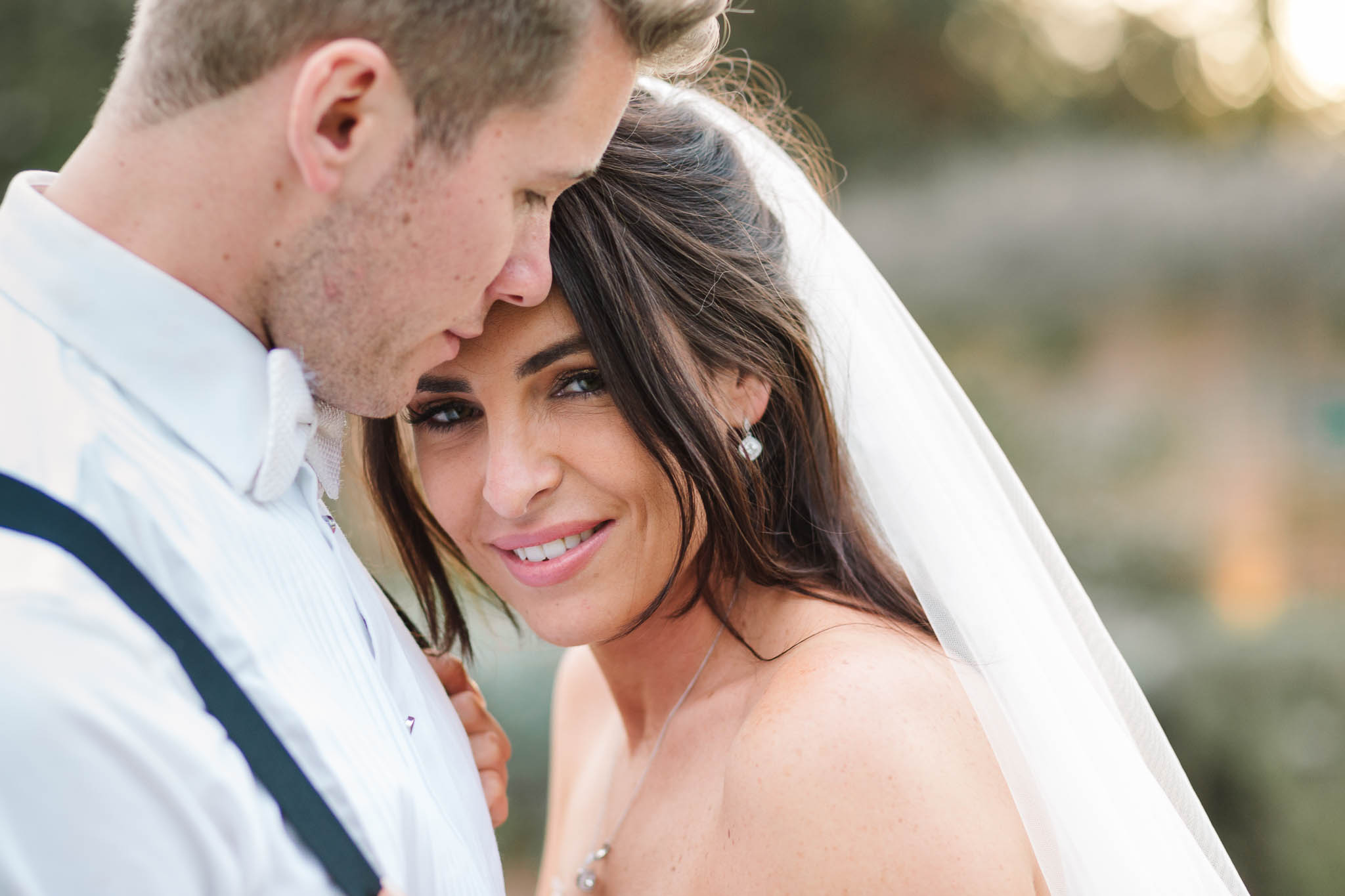 close up photo of bride and groom - elegant and stylish wedding