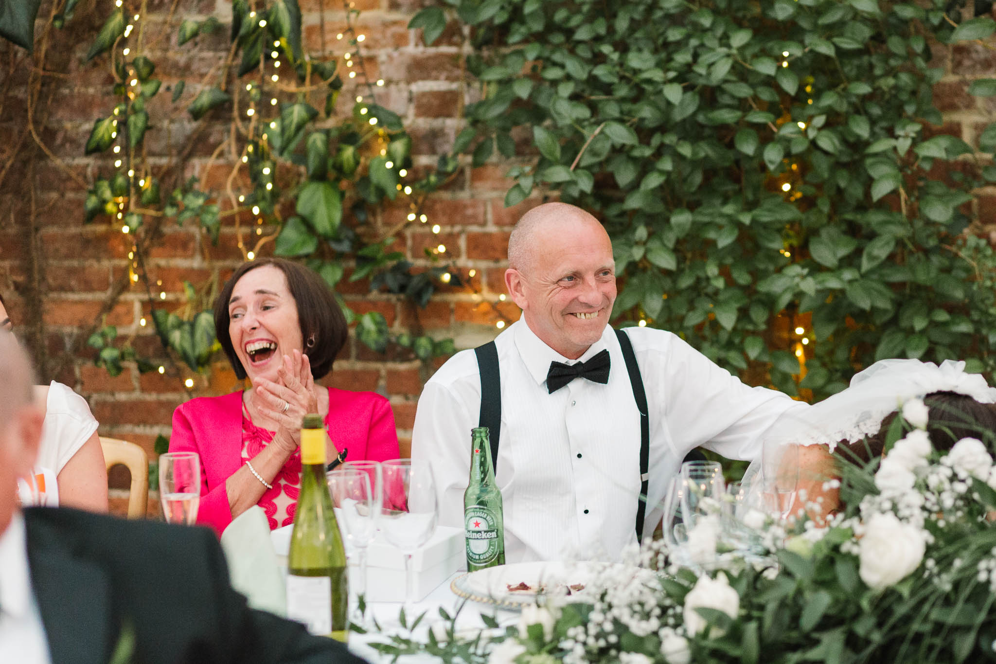 parents laughing at speeches - elegant and stylish wedding