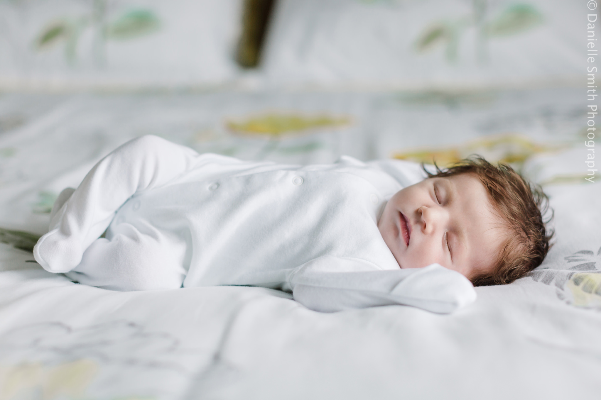 newborn baby sleeping on bed - Relaxed Newborn Baby Photography in South London