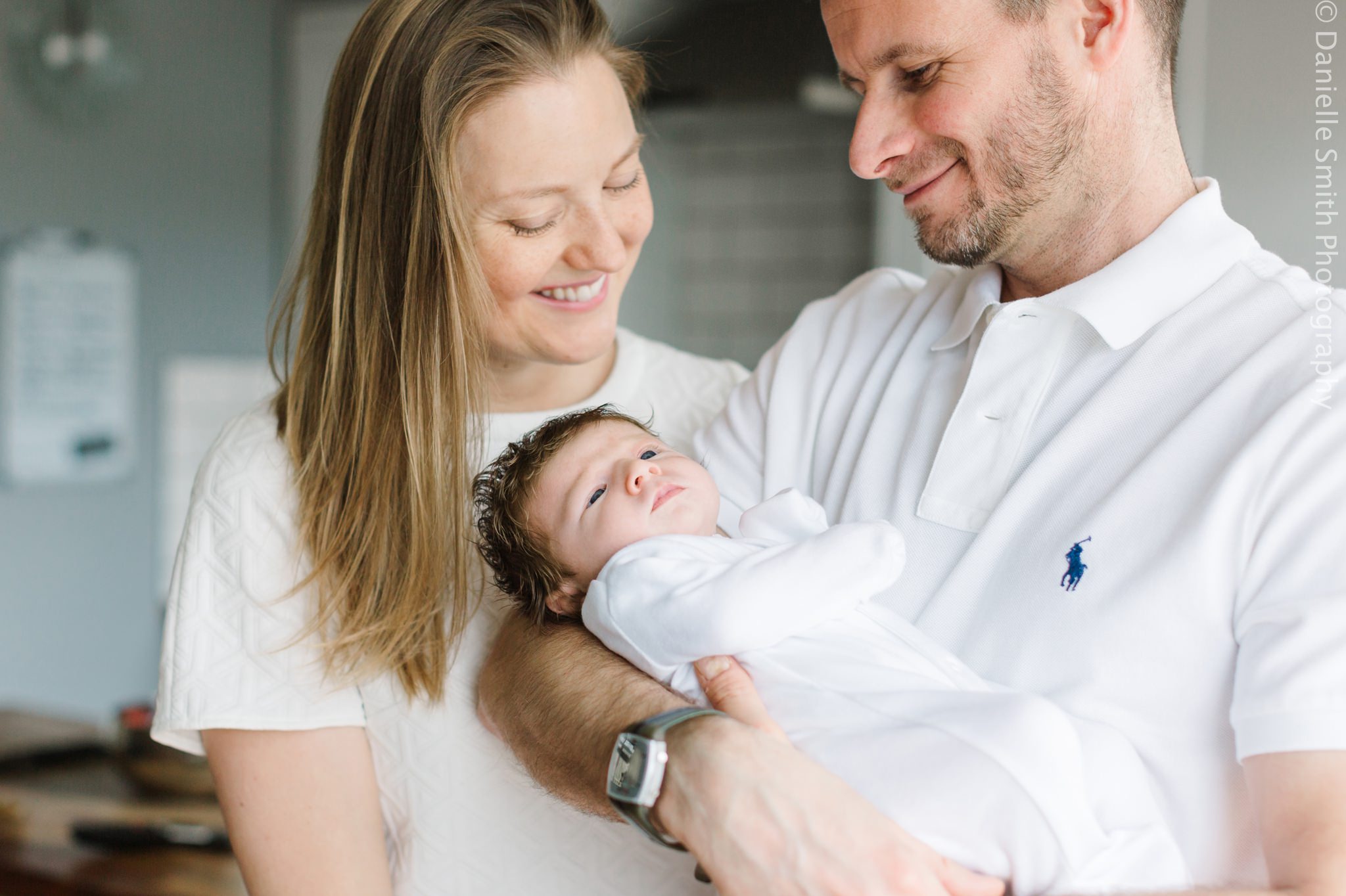 happy mum and dad with new baby